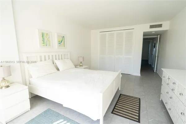 a bedroom with a bed and a cabinets