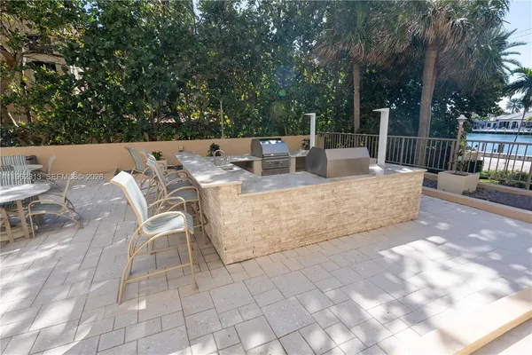 a living room with a couch and a dresser with wooden floor
