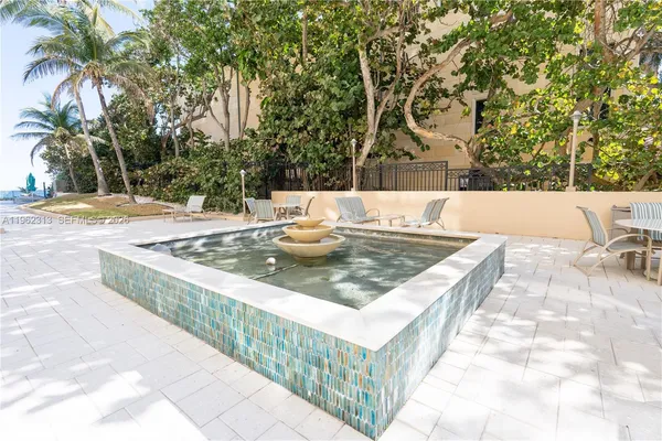 a view of a swimming pool with a lounge chairs