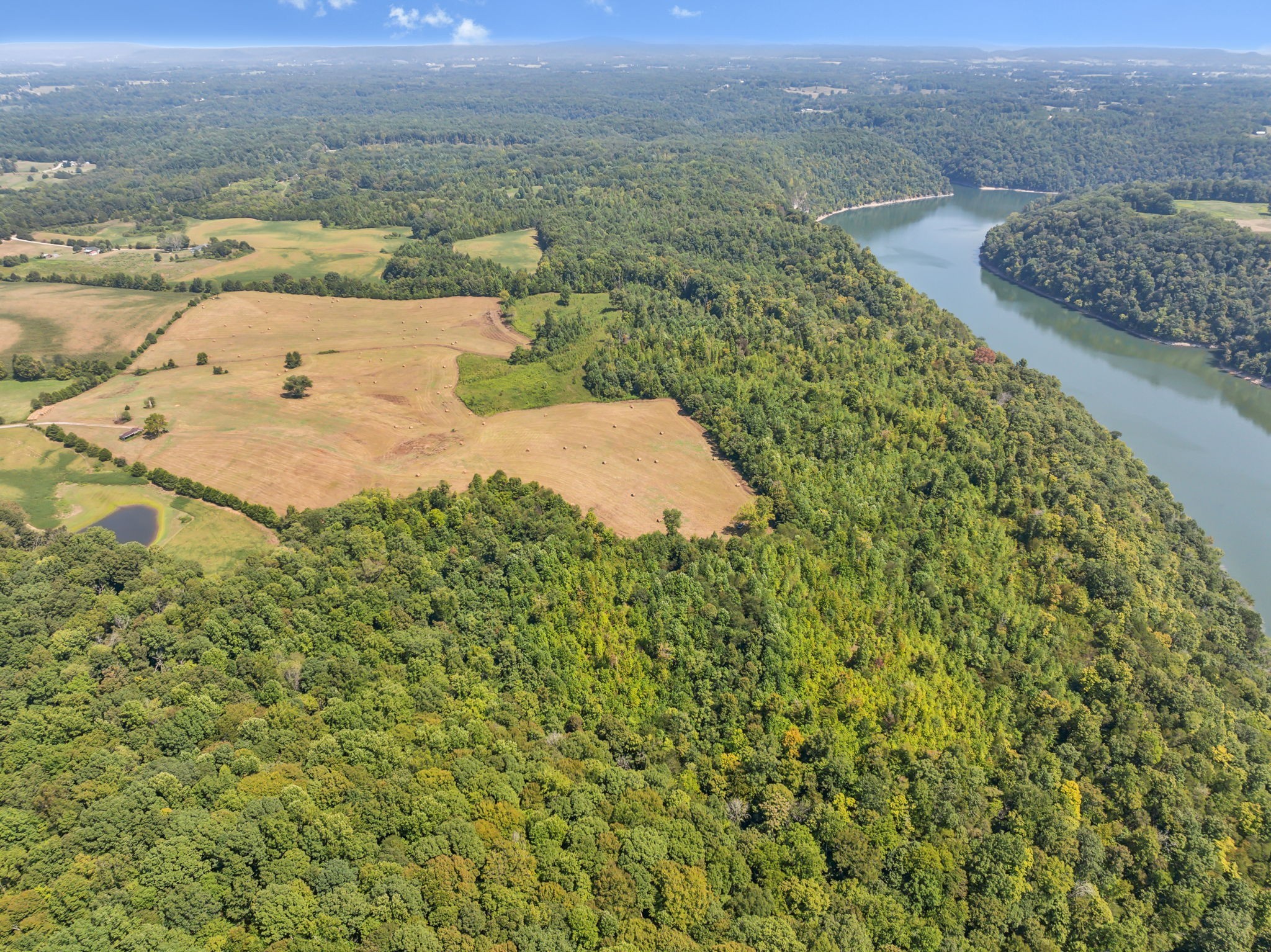 341 Anthony Adcock Road Sparta, TN 38583 - Photo 12 of 37 a view of a lake with a mountain