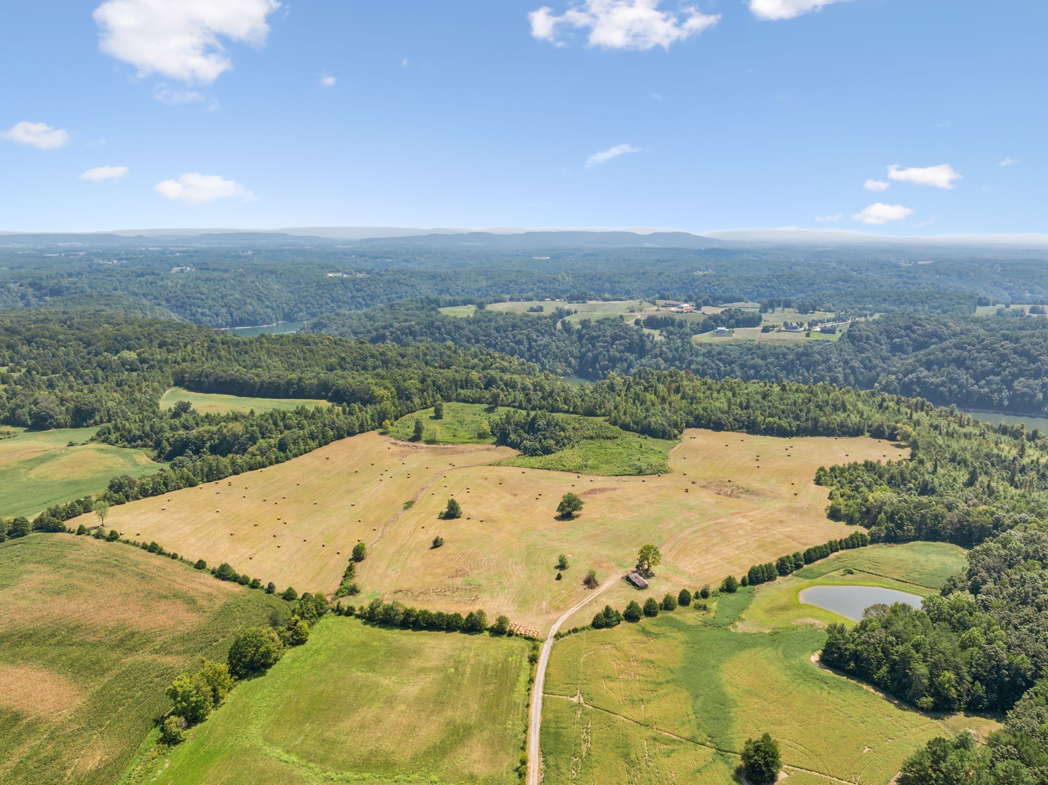 341 Anthony Adcock Road Sparta, TN 38583 - Photo 24 of 37 a view of a big yard with an ocean view