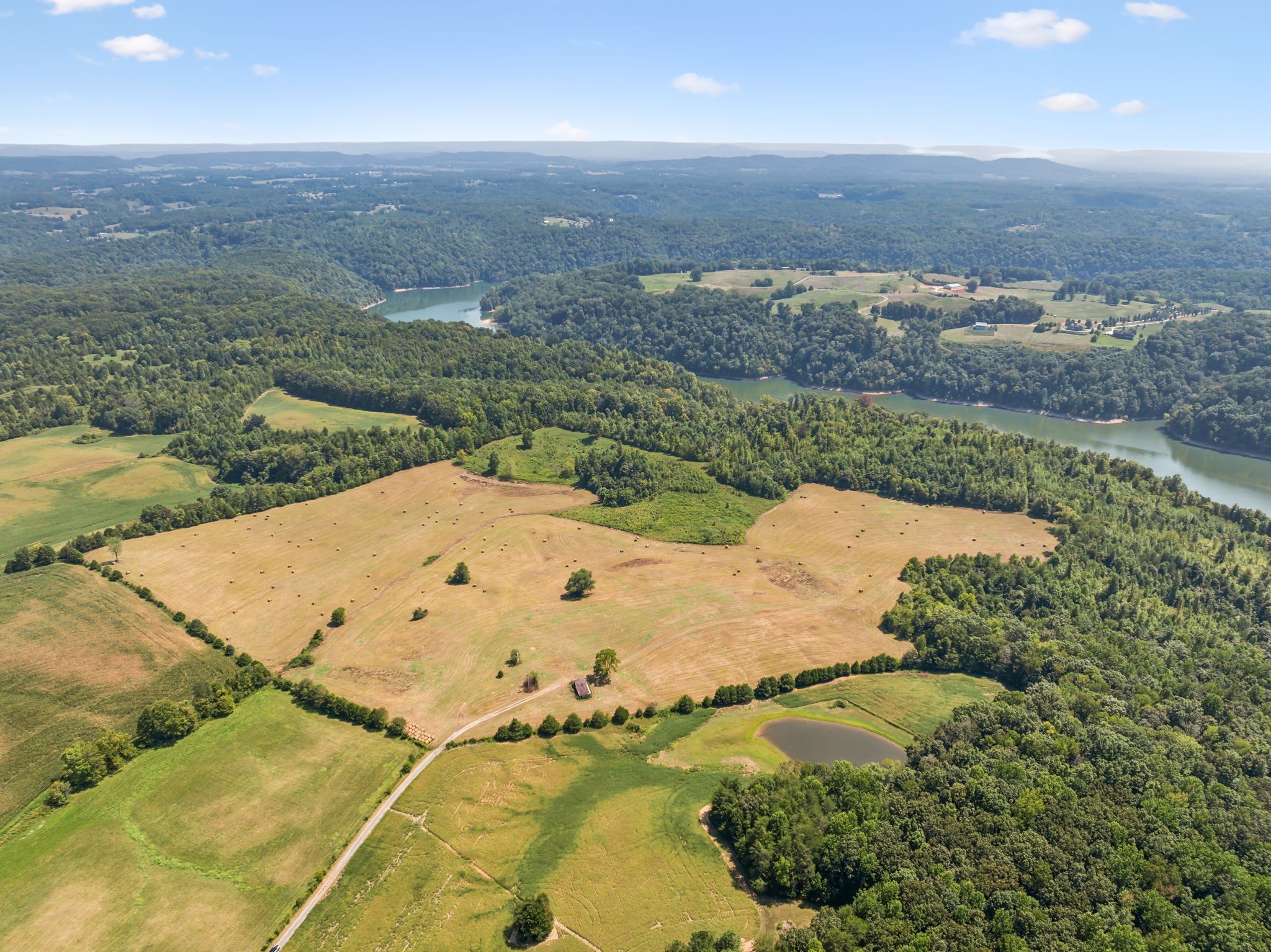 341 Anthony Adcock Road Sparta, TN 38583 - Photo 29 of 37 an aerial view of a residential houses with outdoor space and lake view