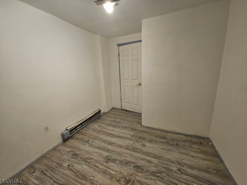 41 Ellison Street, Unit 2 Paterson, NJ 07501 - Photo 2 of 5 a view of room with wooden floor