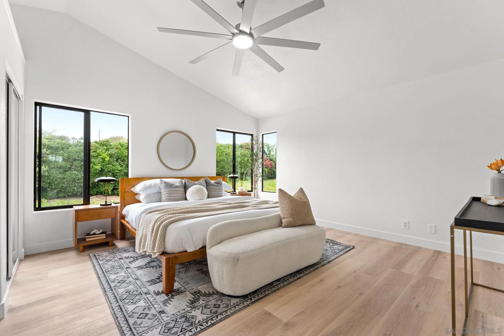 1402 Broken Arrow Lane Fallbrook, CA 92028 - Photo 22 of 34 a bedroom with a large bed and a large window
