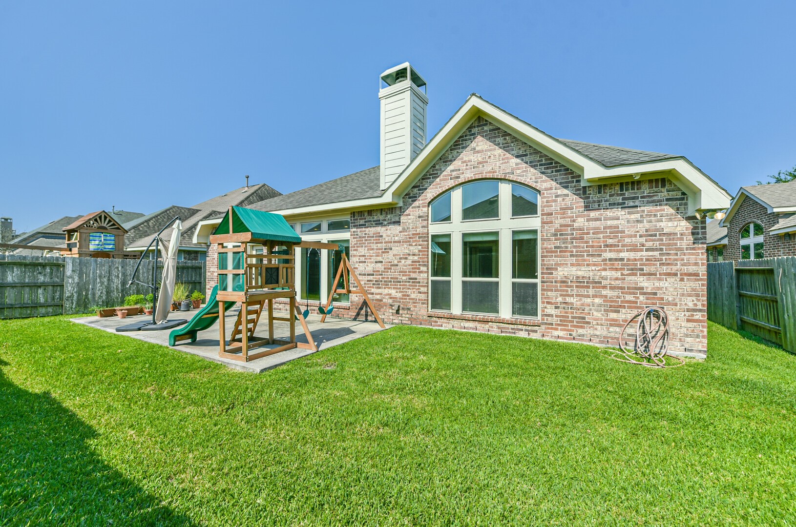 10323 Belvamera Road Richmond, TX 77407 - Photo 25 of 25 Charming backyard perfect for family activities and outdoor enjoyment.