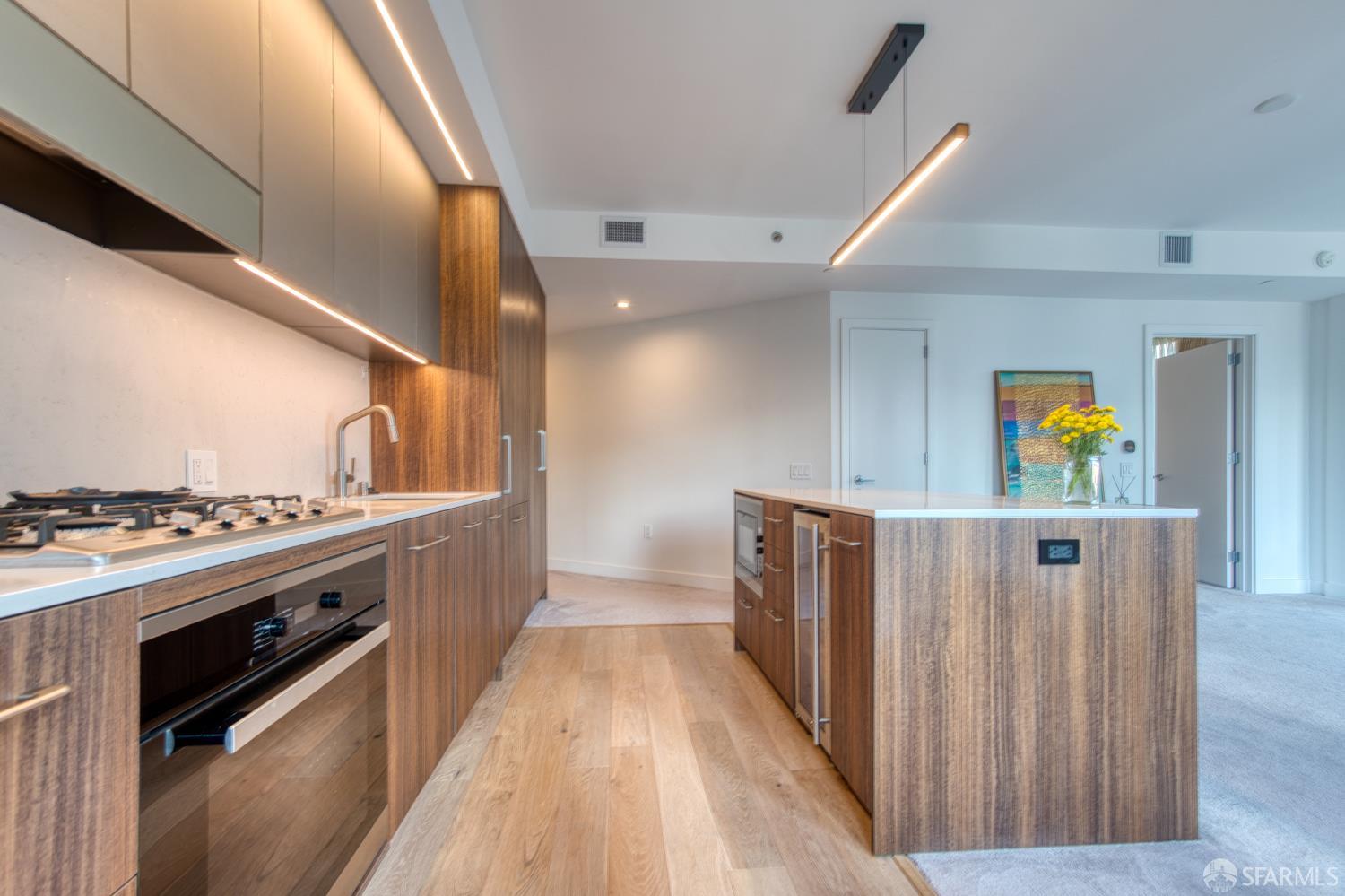 280 Spear Street, Unit 9C San Francisco, CA 94105 - Photo 5 of 11 a view of a kitchen with wooden floor