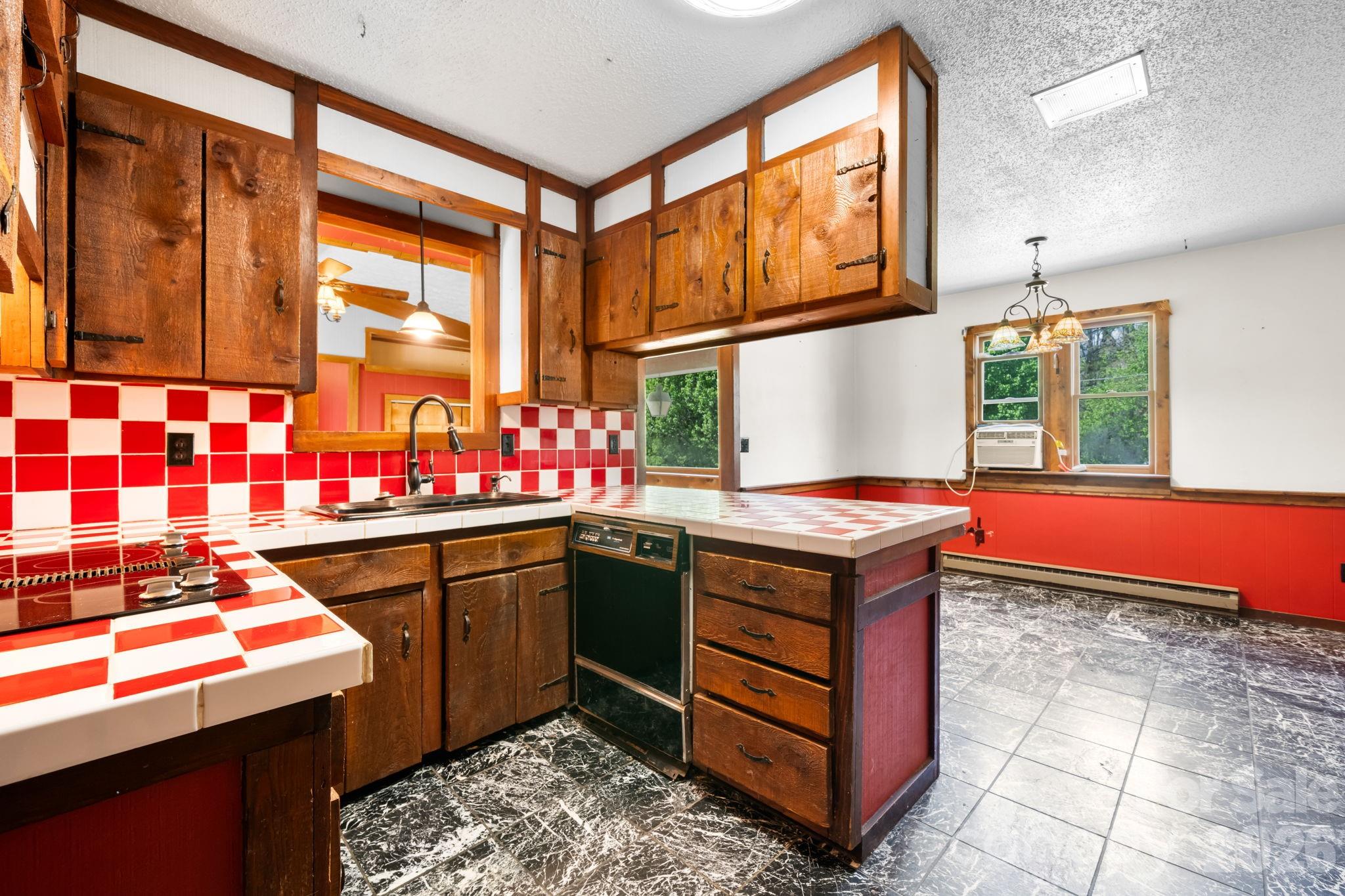 103 Bernice Street Marion, NC 28752 - Photo 14 of 48 a kitchen that has a sink cabinets and window