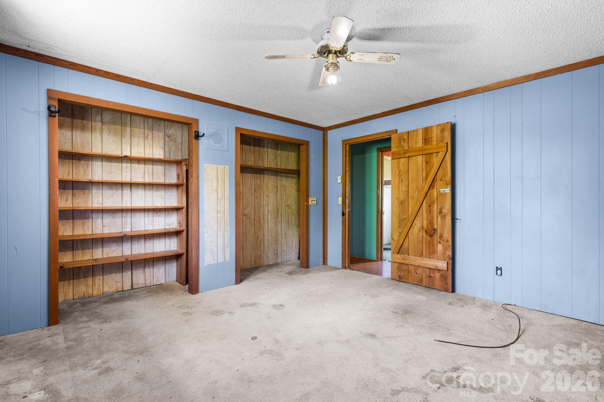 103 Bernice Street Marion, NC 28752 - Photo 19 of 48 a view of empty room with a ceiling fan and a ceiling fan