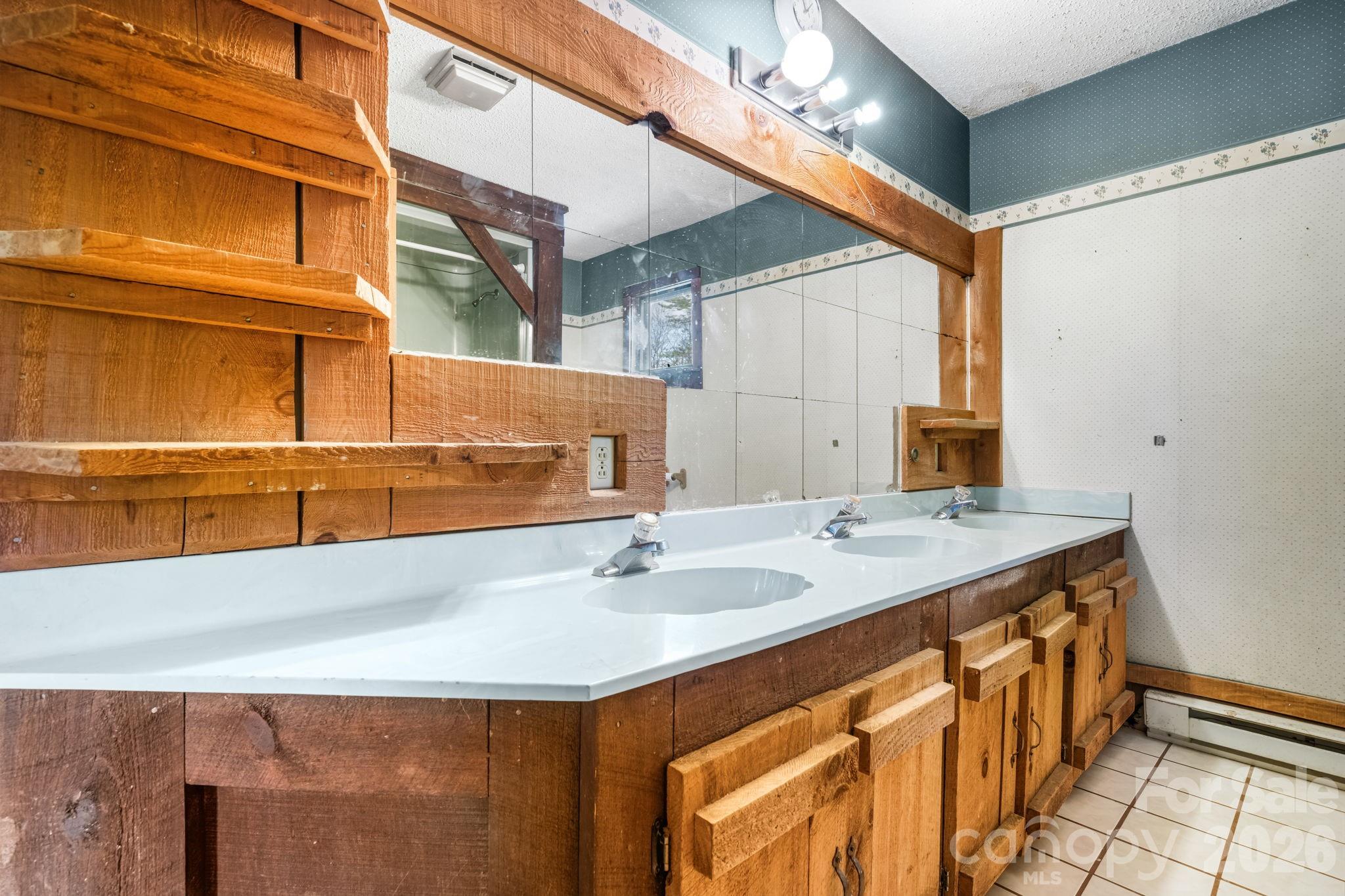 103 Bernice Street Marion, NC 28752 - Photo 20 of 48 a bathroom with a sink and a mirror