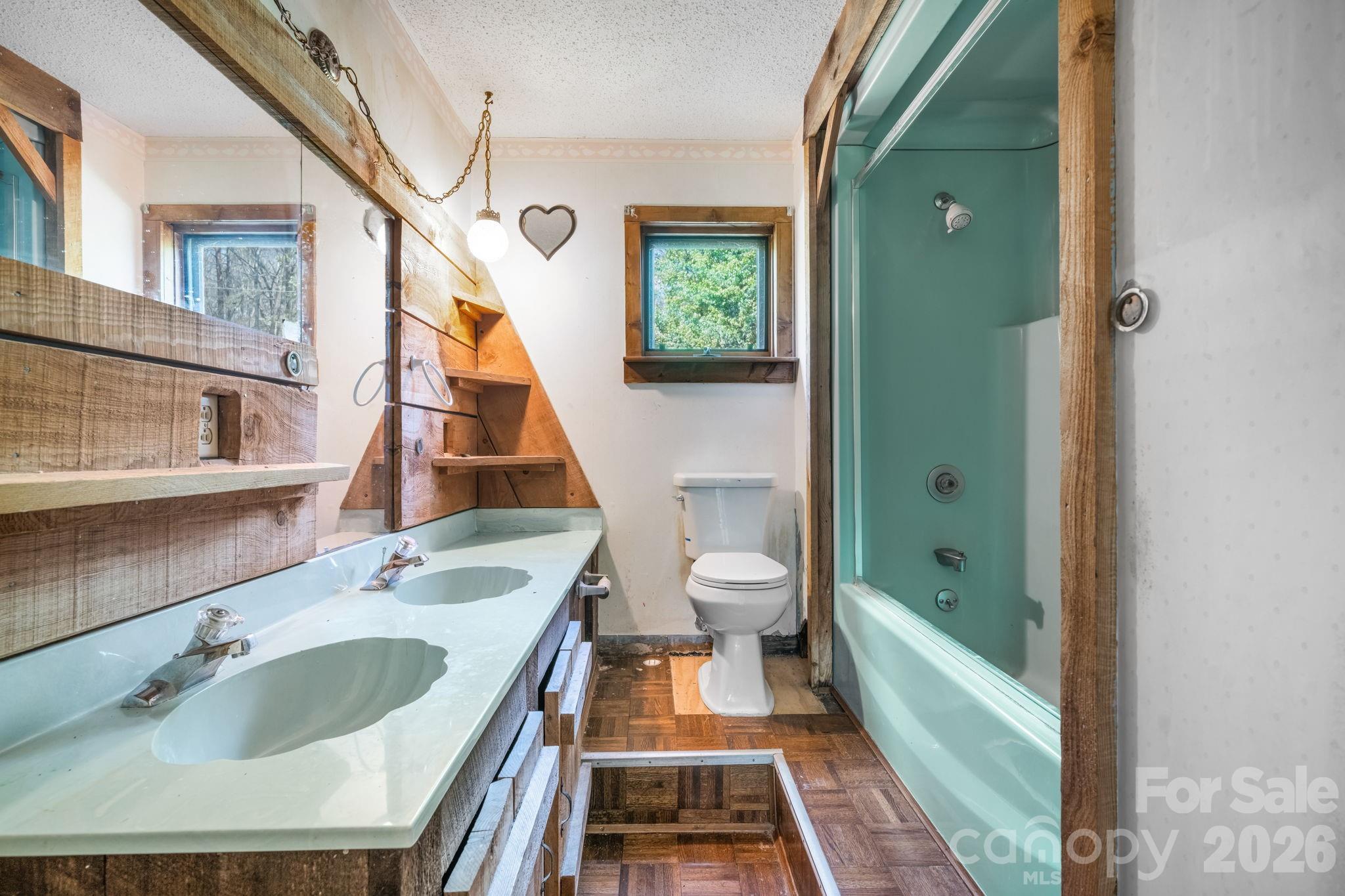 103 Bernice Street Marion, NC 28752 - Photo 22 of 48 a bathroom with a sink and a mirror