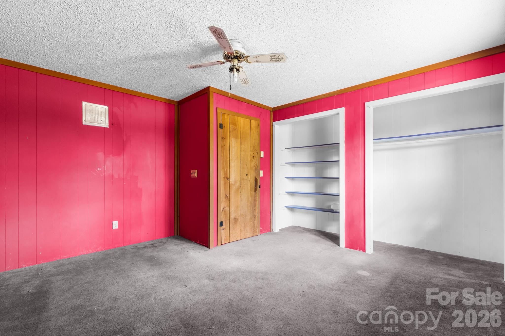 103 Bernice Street Marion, NC 28752 - Photo 25 of 48 a view of a room with a projector and ceiling fan