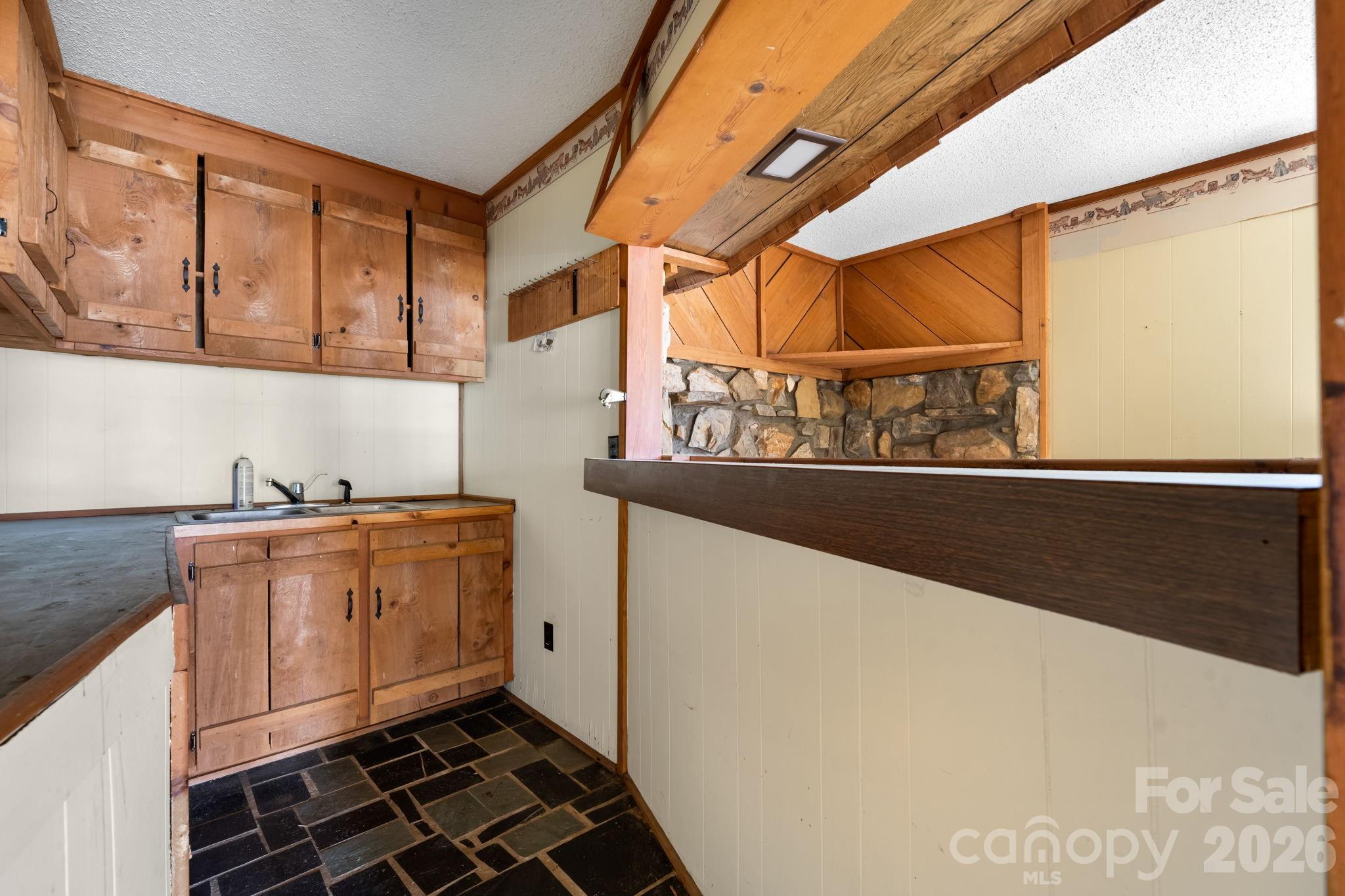 103 Bernice Street Marion, NC 28752 - Photo 33 of 48 a kitchen with stainless steel appliances granite countertop a sink and a cabinets