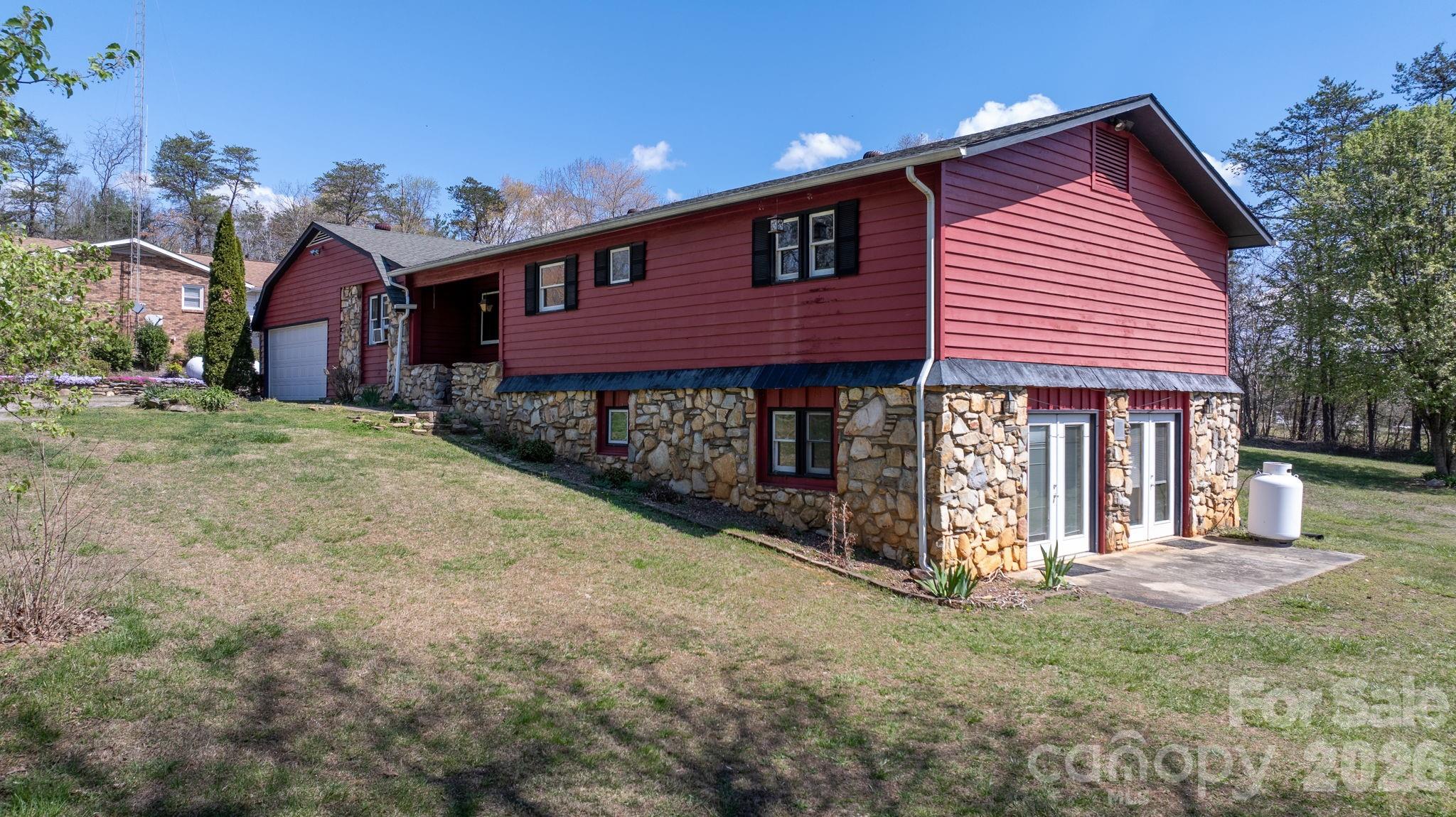103 Bernice Street Marion, NC 28752 - Photo 4 of 48 a front view of a house with a yard