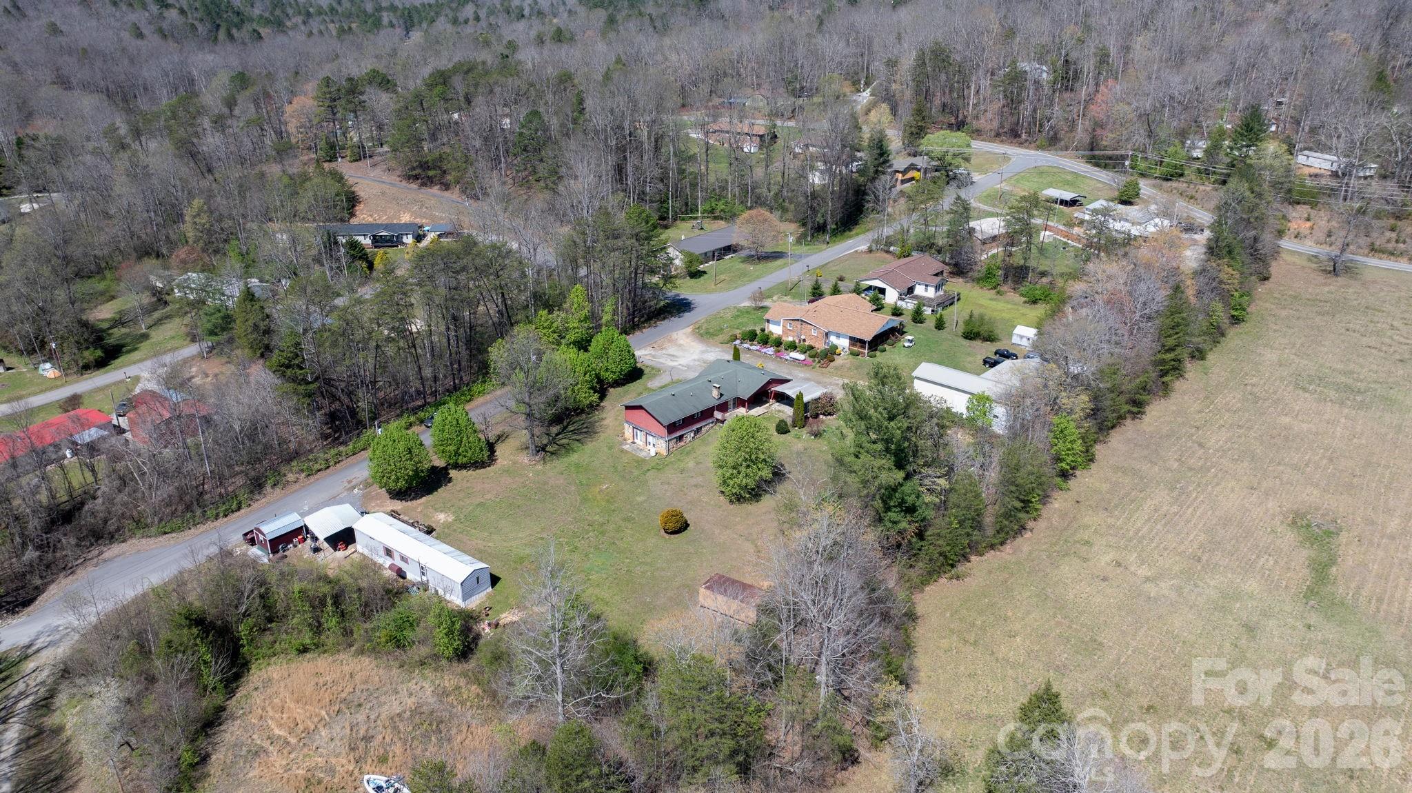 103 Bernice Street Marion, NC 28752 - Photo 48 of 48 an aerial view of a house with a yard and trees