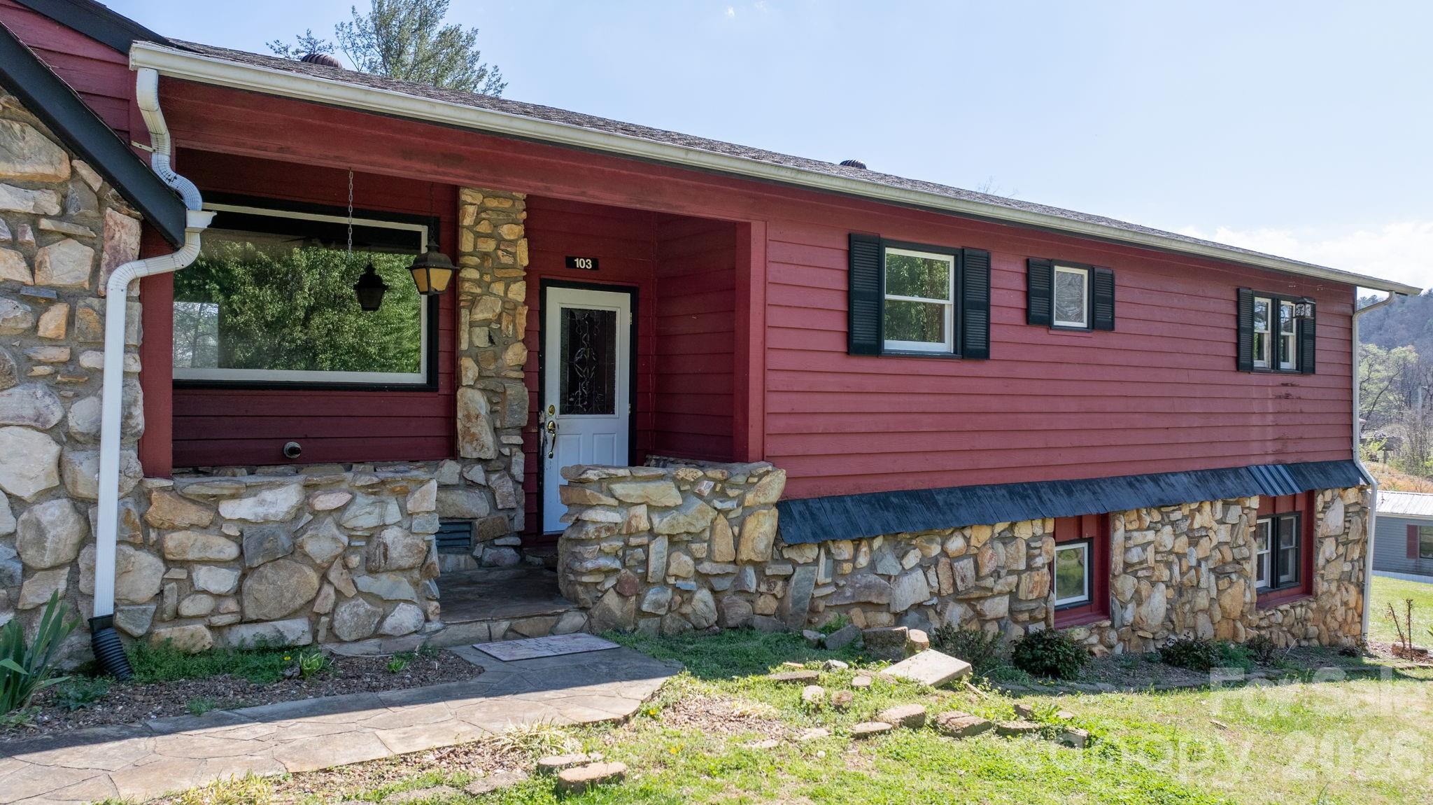 103 Bernice Street Marion, NC 28752 - Photo 5 of 48 a front view of a house with garden