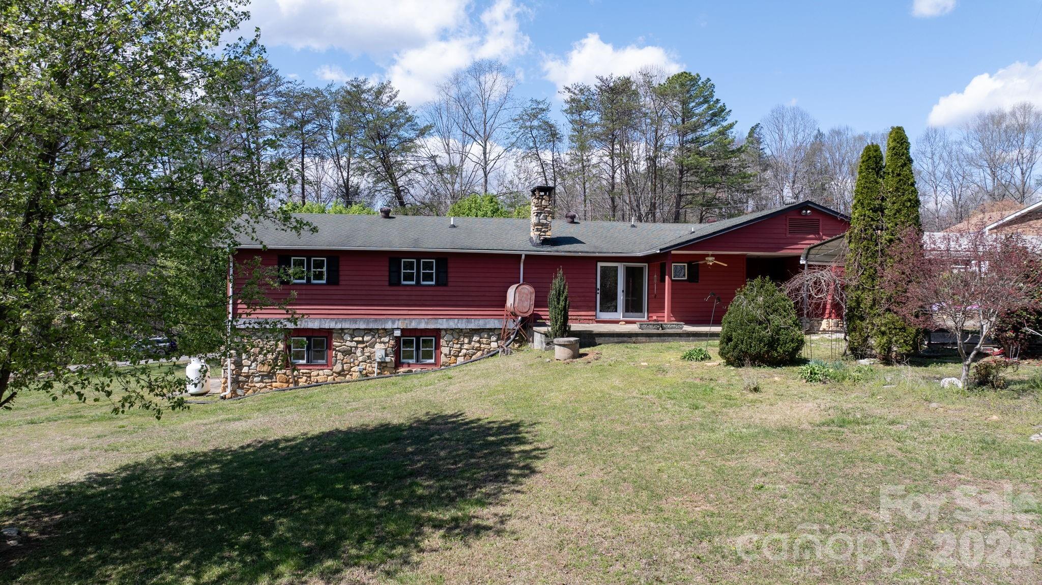 103 Bernice Street Marion, NC 28752 - Photo 6 of 48 a view of a big yard with large trees