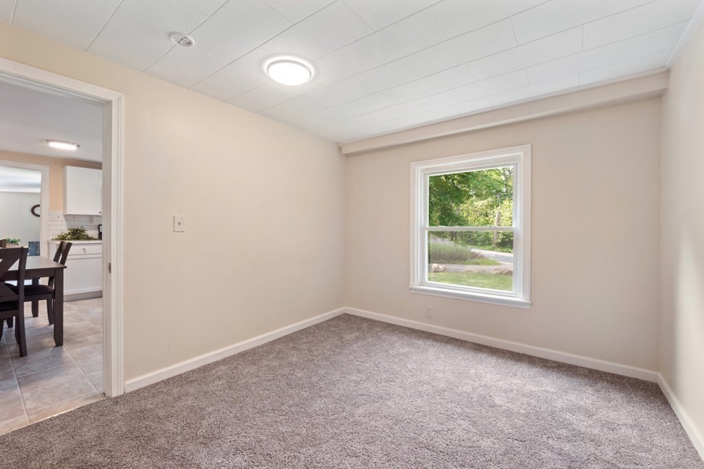 46 New State Road Montgomery, MA 01085 - Photo 13 of 20 an empty room with furniture and a window