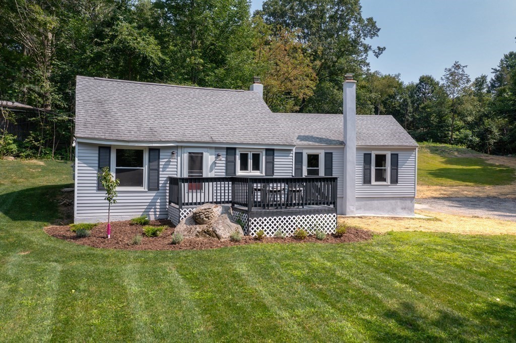 46 New State Road Montgomery, MA 01085 - Photo 2 of 20 a front view of a house with a garden