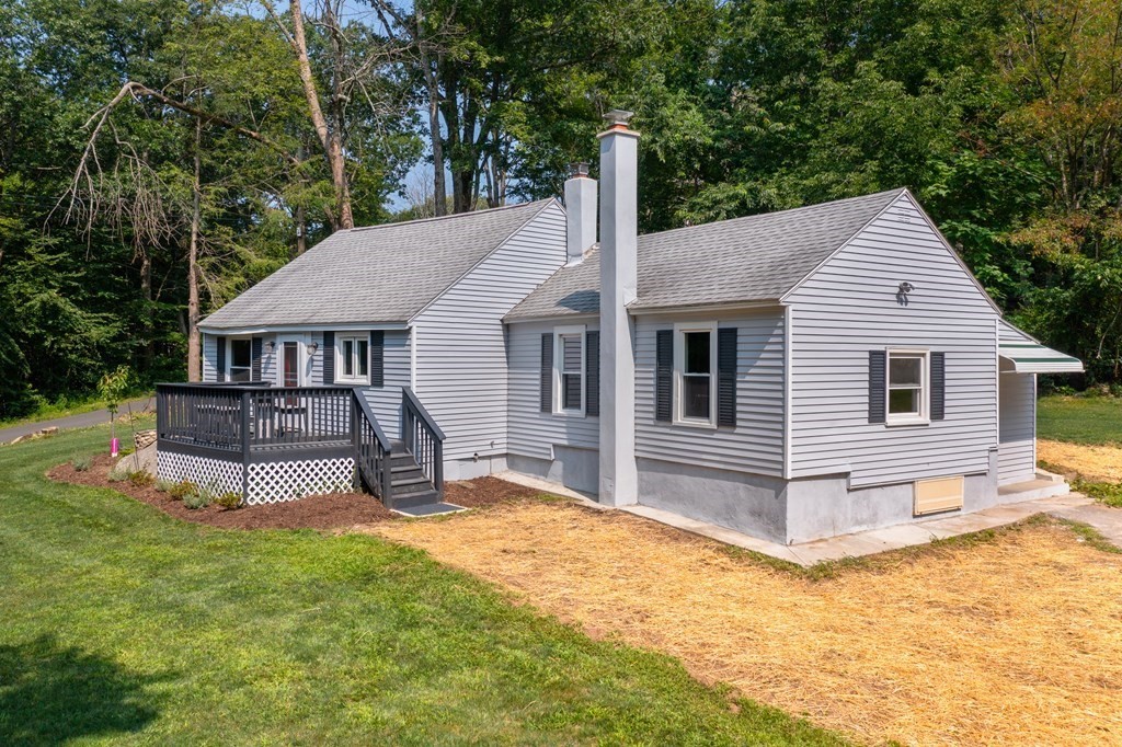 46 New State Road Montgomery, MA 01085 - Photo 4 of 20 a view of a house with a big yard and large tree