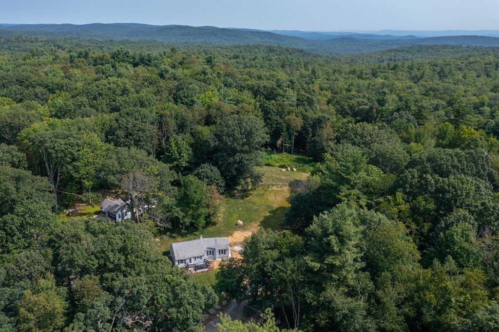 46 New State Road Montgomery, MA 01085 - Photo 5 of 20 an aerial view of residential house with outdoor space and trees all around