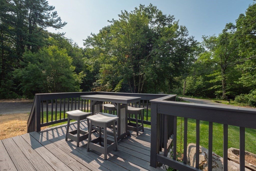 46 New State Road Montgomery, MA 01085 - Photo 6 of 20 a view of balcony with wooden floor and outdoor seating