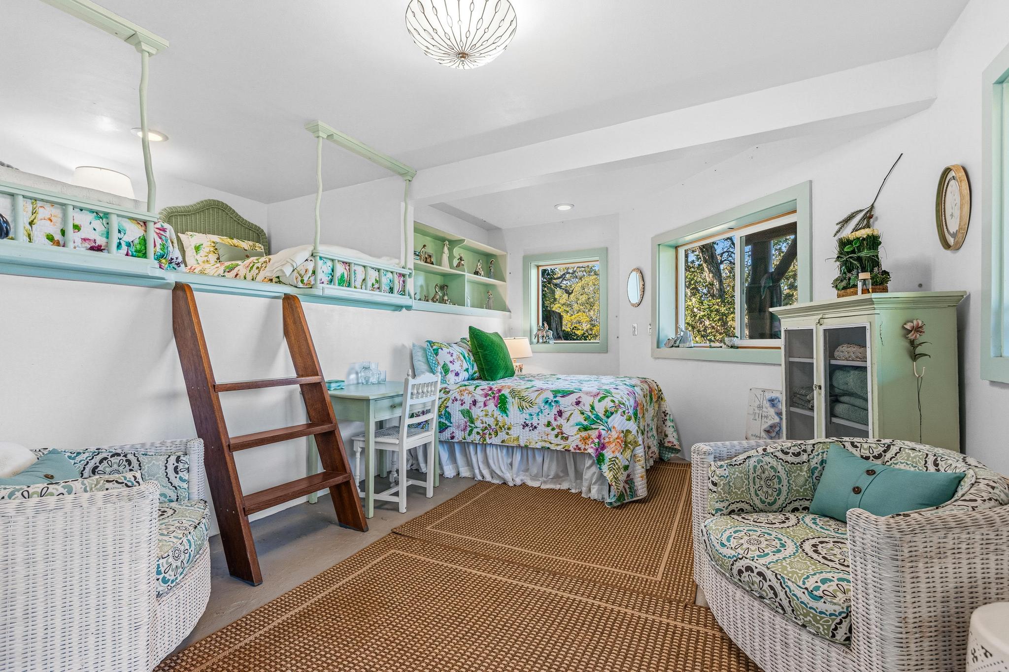 43-5745 Old Stable Road Paauilo, HI 96776 - Photo 27 of 30 a bedroom with furniture and a wooden floor