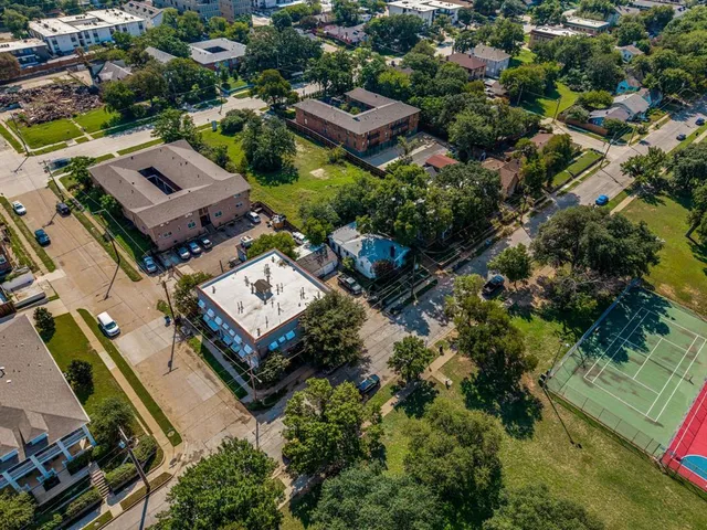 an aerial view of a city with lots of residential buildings