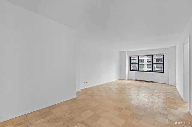 a view of an empty room with a window