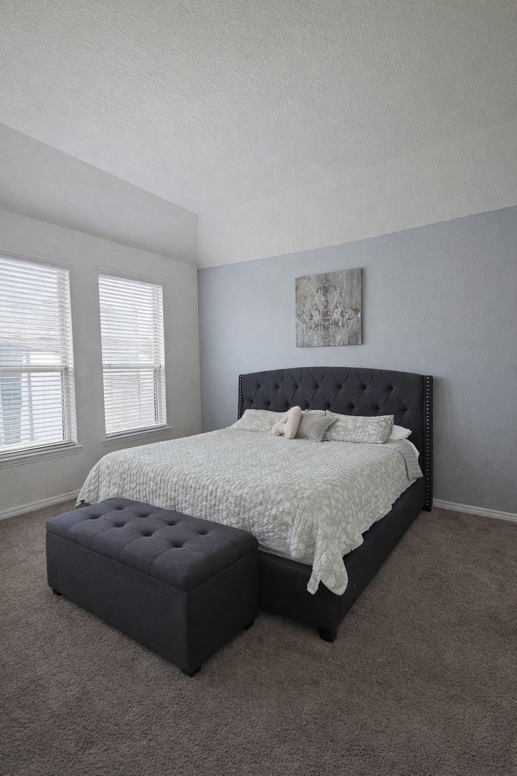 16410 Regal Exeter Drive Houston, TX 77073 - Photo 12 of 21 a spacious bedroom with a bed lamp and window