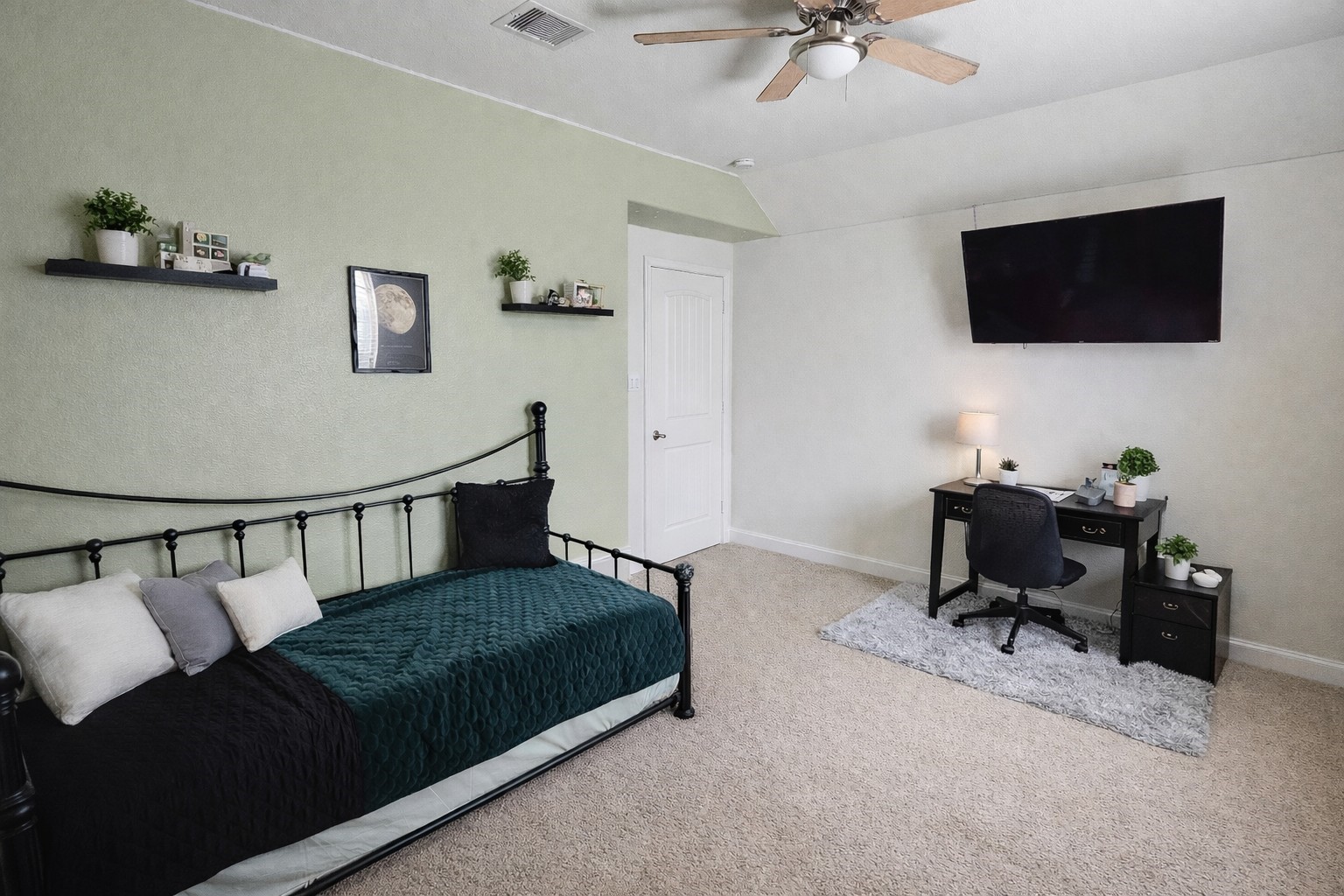 16410 Regal Exeter Drive Houston, TX 77073 - Photo 19 of 21 a living room with furniture and a flat screen tv
