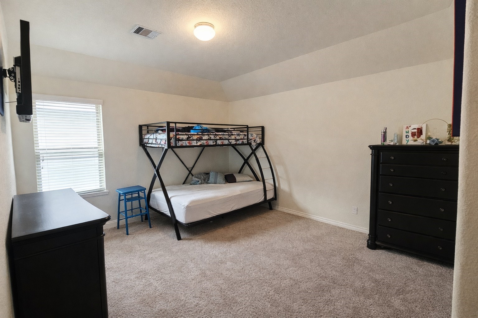 16410 Regal Exeter Drive Houston, TX 77073 - Photo 20 of 21 a bedroom with a bed and a dresser