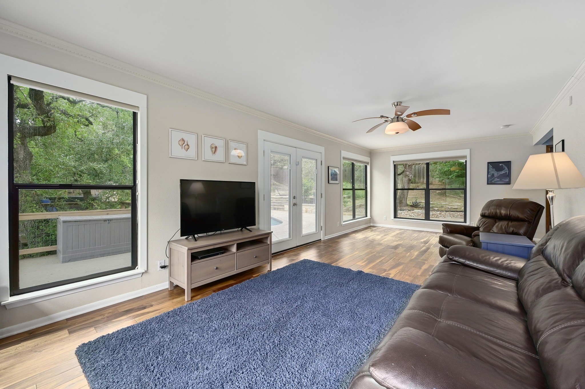 2009 South Oak Canyon Road Austin, TX 78746 - Photo 17 of 37 a living room with furniture and a flat screen tv