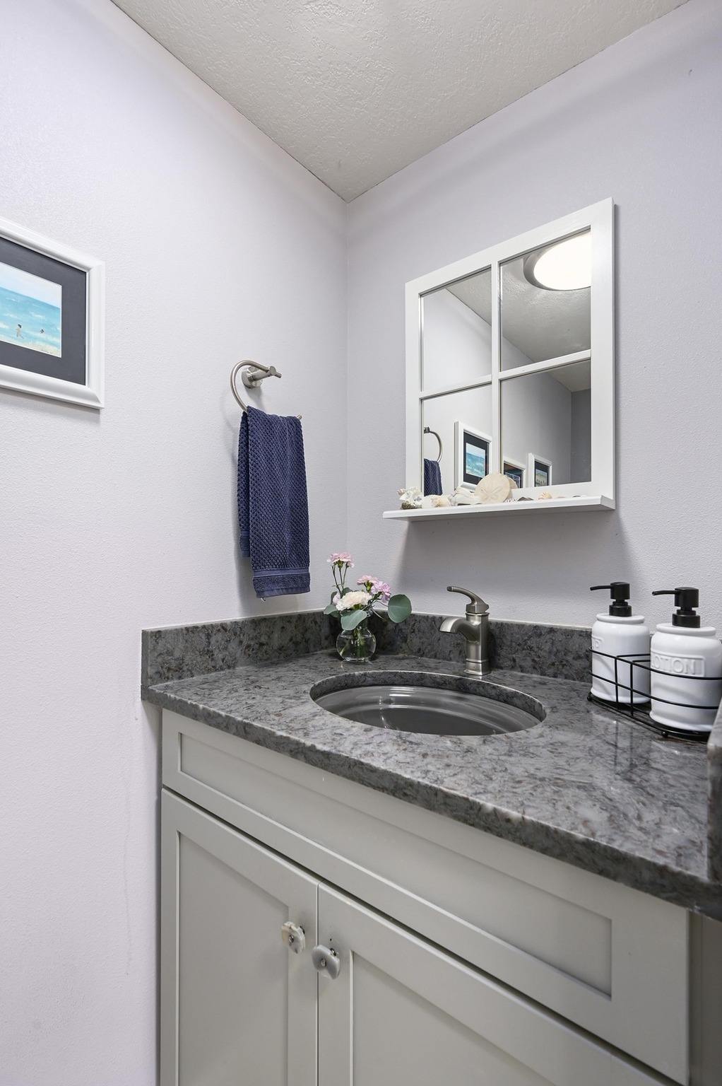 2009 South Oak Canyon Road Austin, TX 78746 - Photo 18 of 37 a kitchen with a sink and cabinets