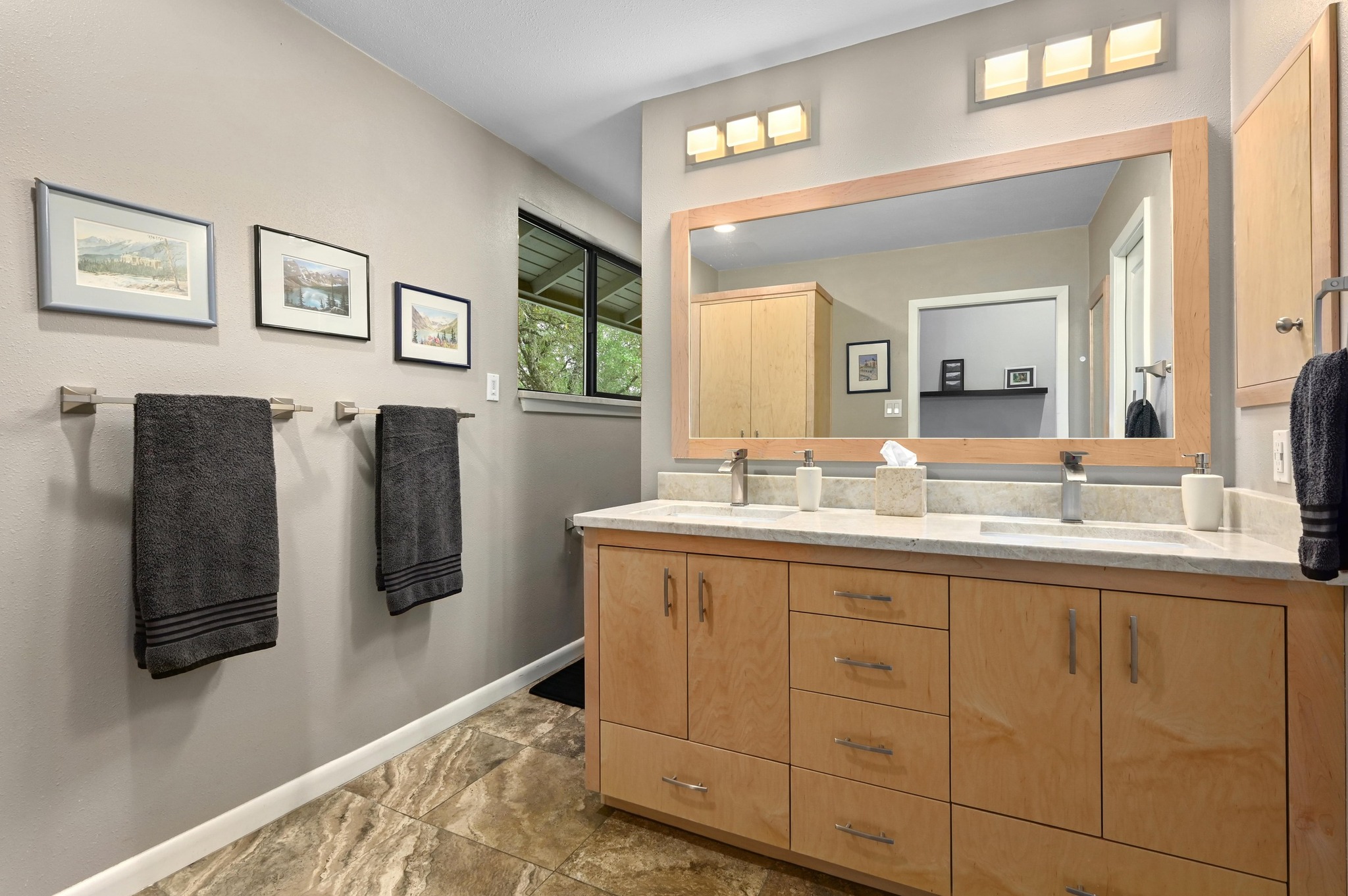 2009 South Oak Canyon Road Austin, TX 78746 - Photo 21 of 37 a bathroom with a double vanity sink and mirror