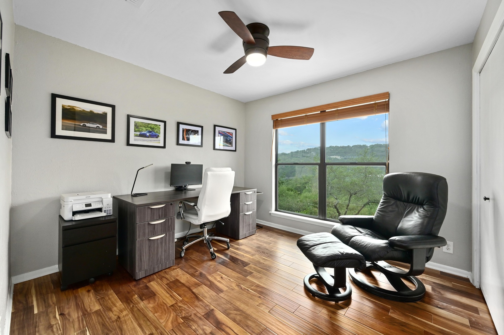 2009 South Oak Canyon Road Austin, TX 78746 - Photo 24 of 37 a view of a workspace with furniture and a window