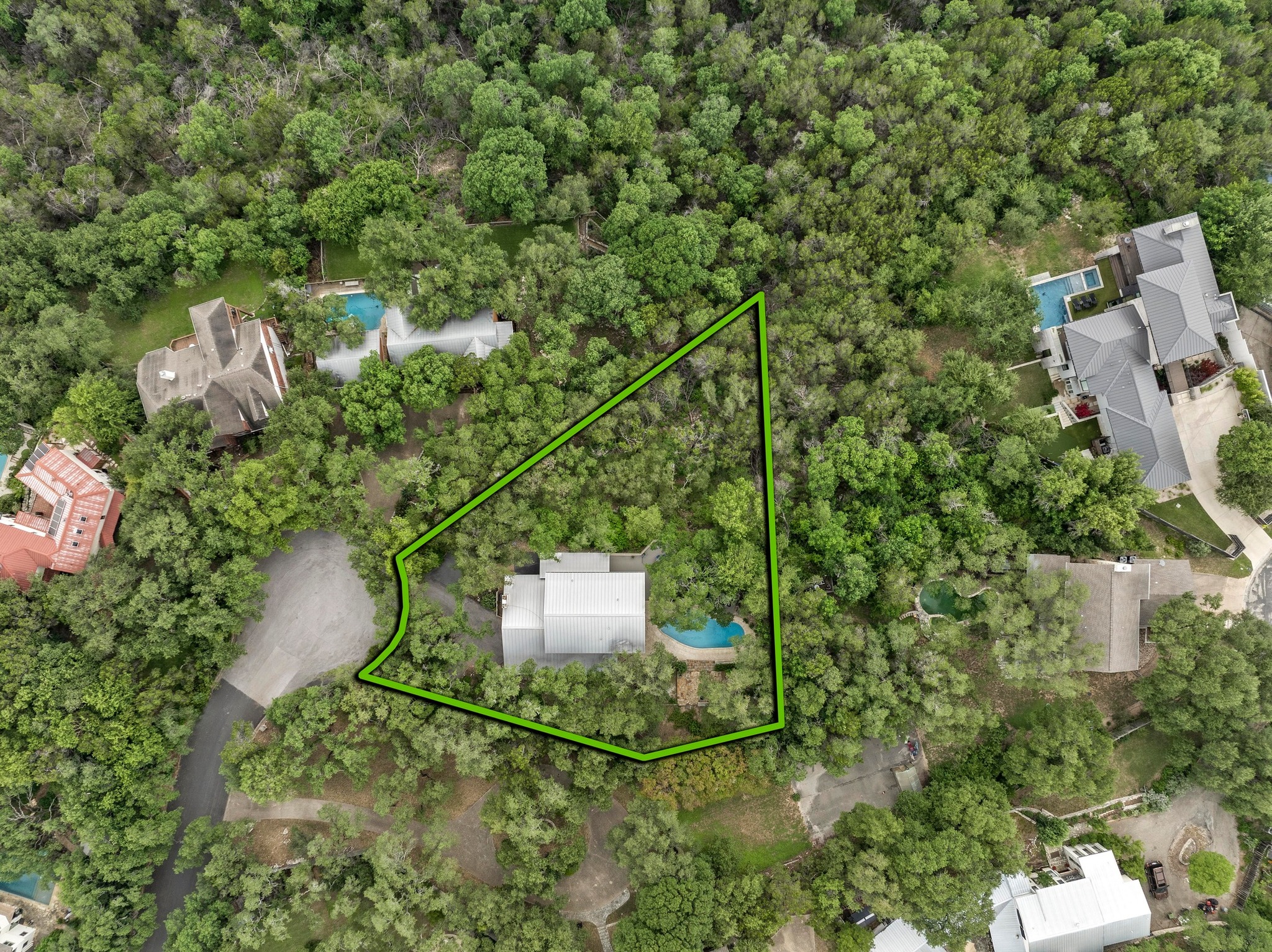 2009 South Oak Canyon Road Austin, TX 78746 - Photo 31 of 37 a aerial view of a house with a yard and large trees