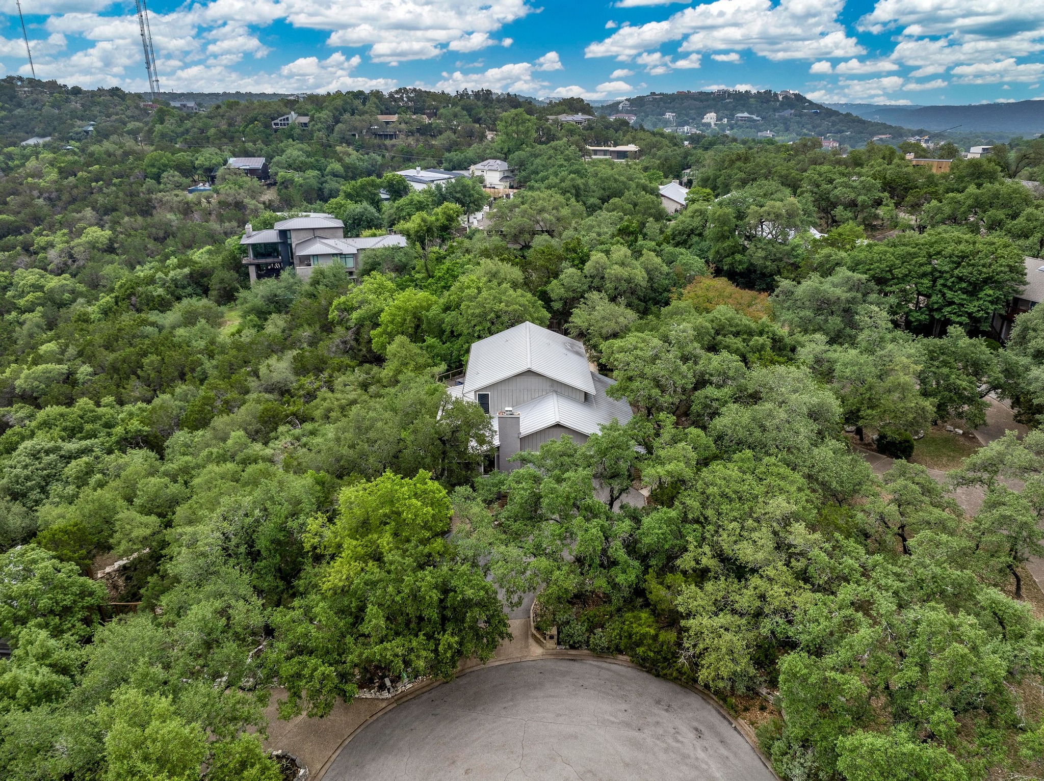 2009 South Oak Canyon Road Austin, TX 78746 - Photo 32 of 37 an aerial view of a house with a yard