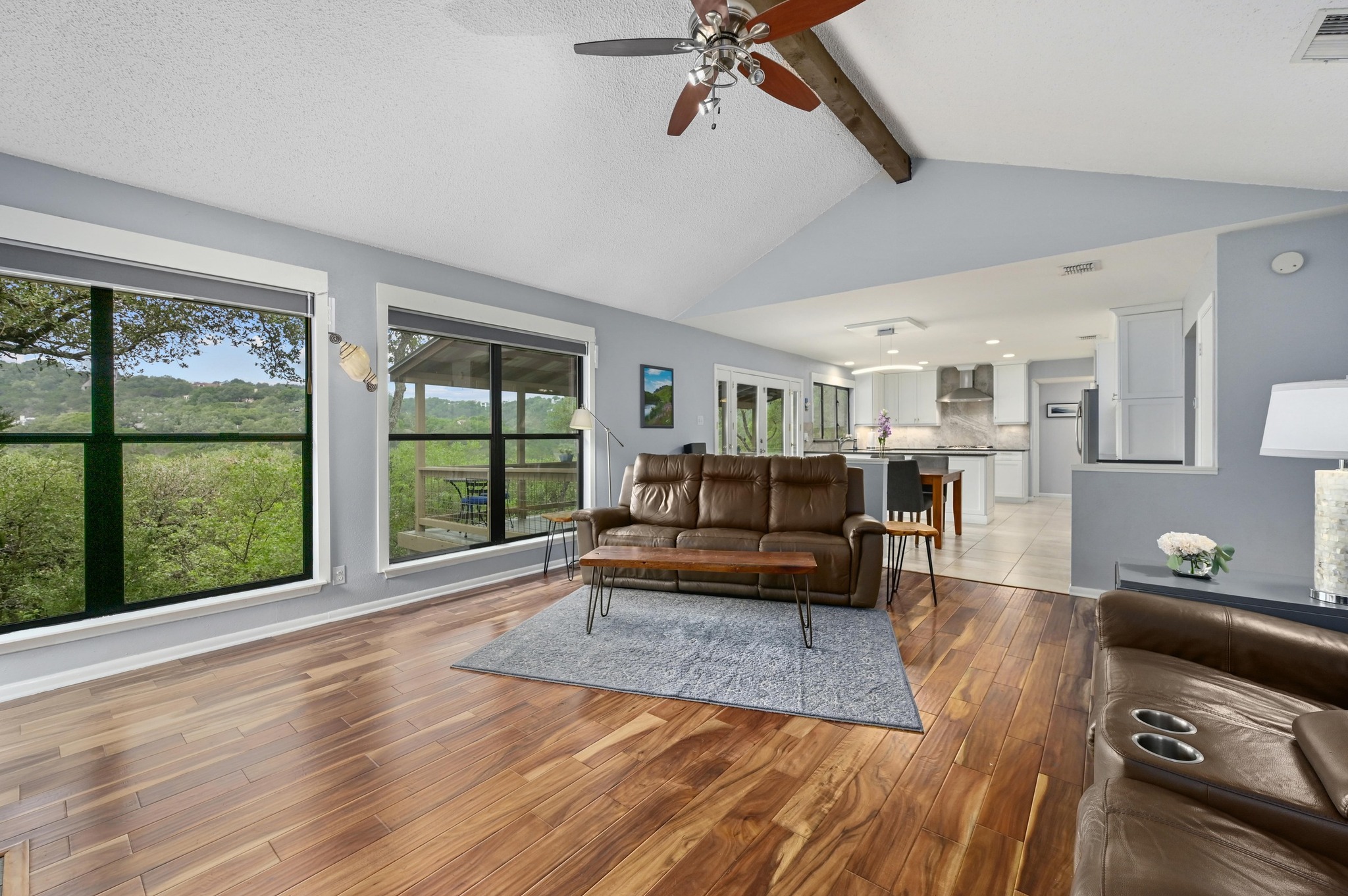 2009 South Oak Canyon Road Austin, TX 78746 - Photo 9 of 37 a living room with furniture and a large window