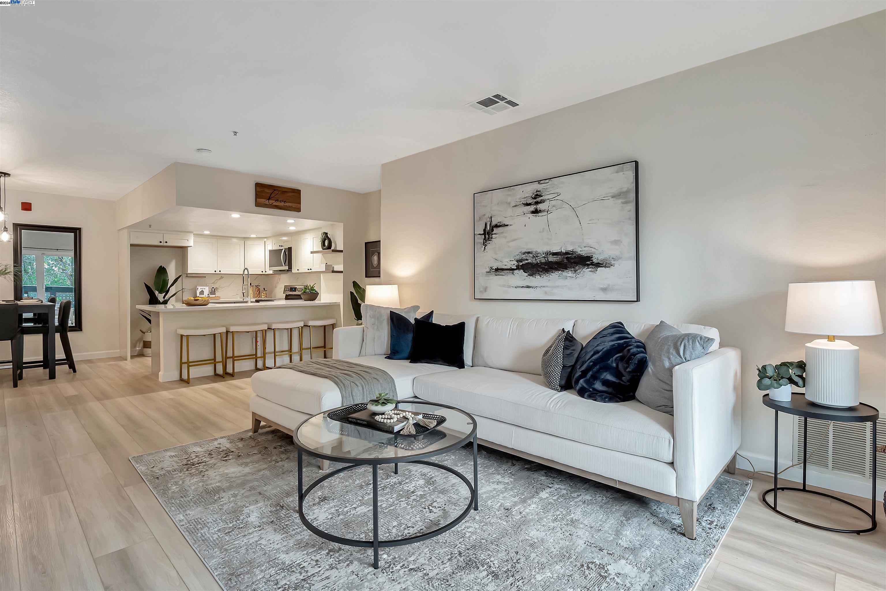Undisclosed Address San Ramon, CA 94583 - Photo 1 of 40 a living room with furniture a rug and kitchen view