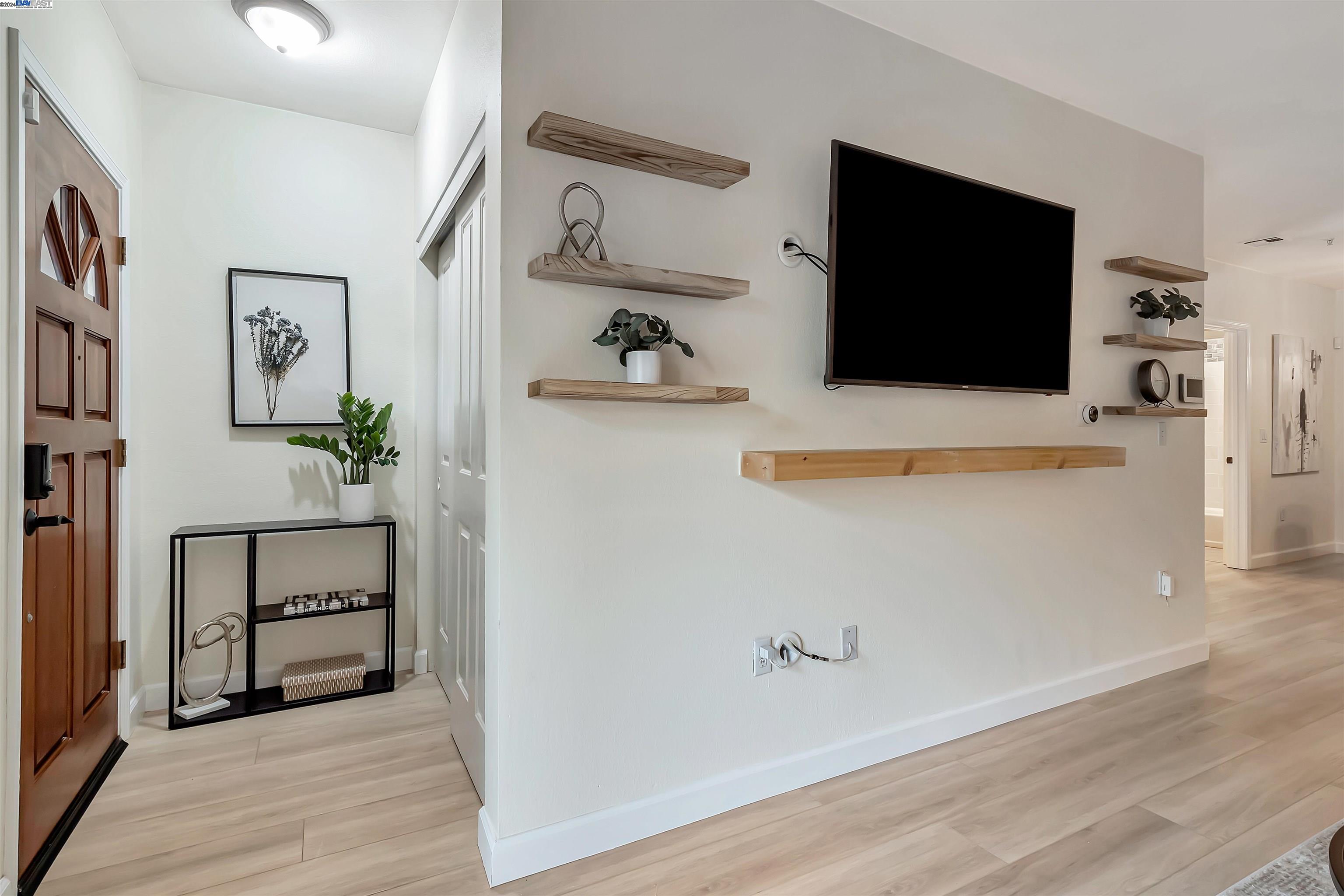 Undisclosed Address San Ramon, CA 94583 - Photo 11 of 40 a view of a livingroom with wooden floor and cabinet