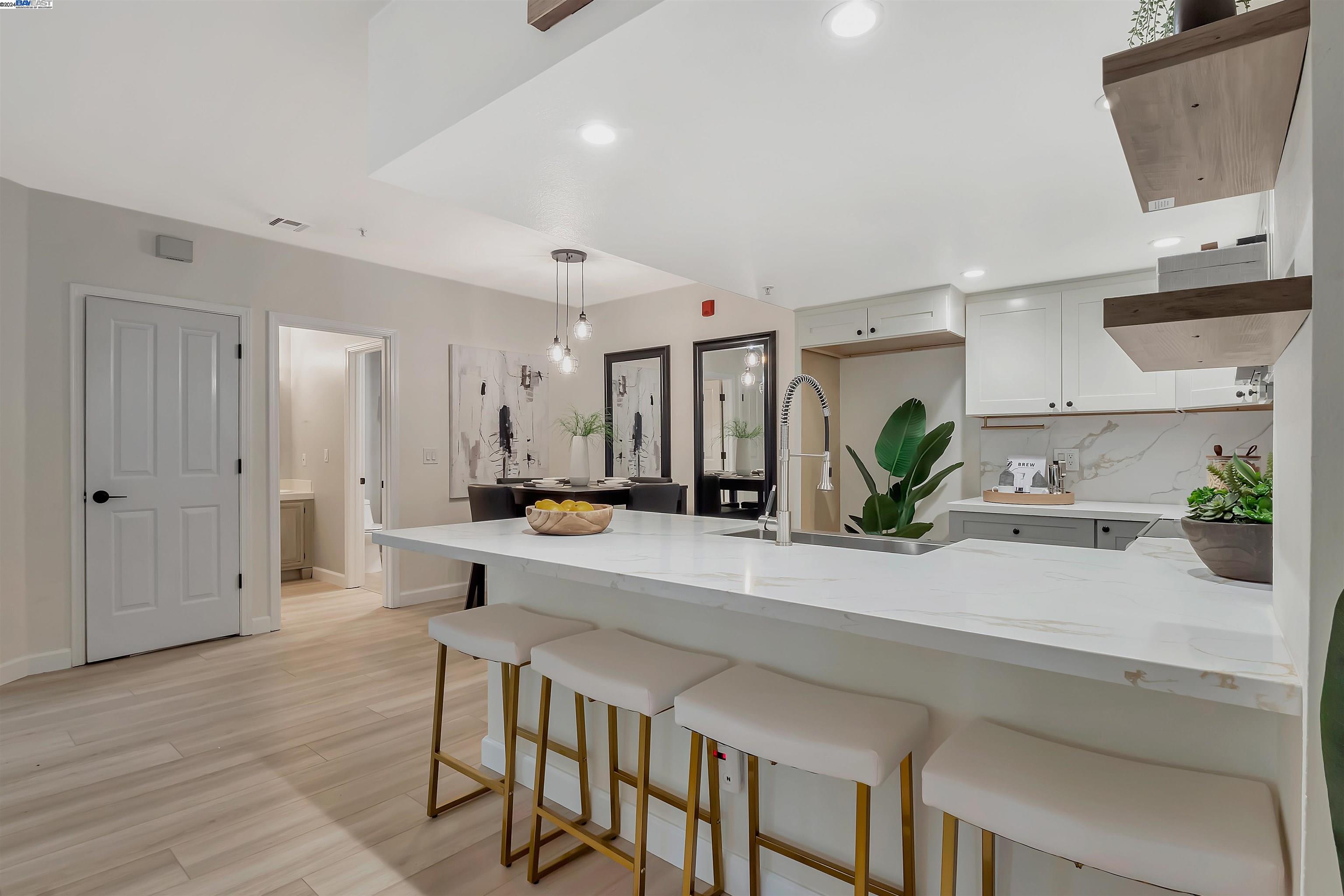 Undisclosed Address San Ramon, CA 94583 - Photo 16 of 40 a view of kitchen with kitchen island a sink and wooden cabinets