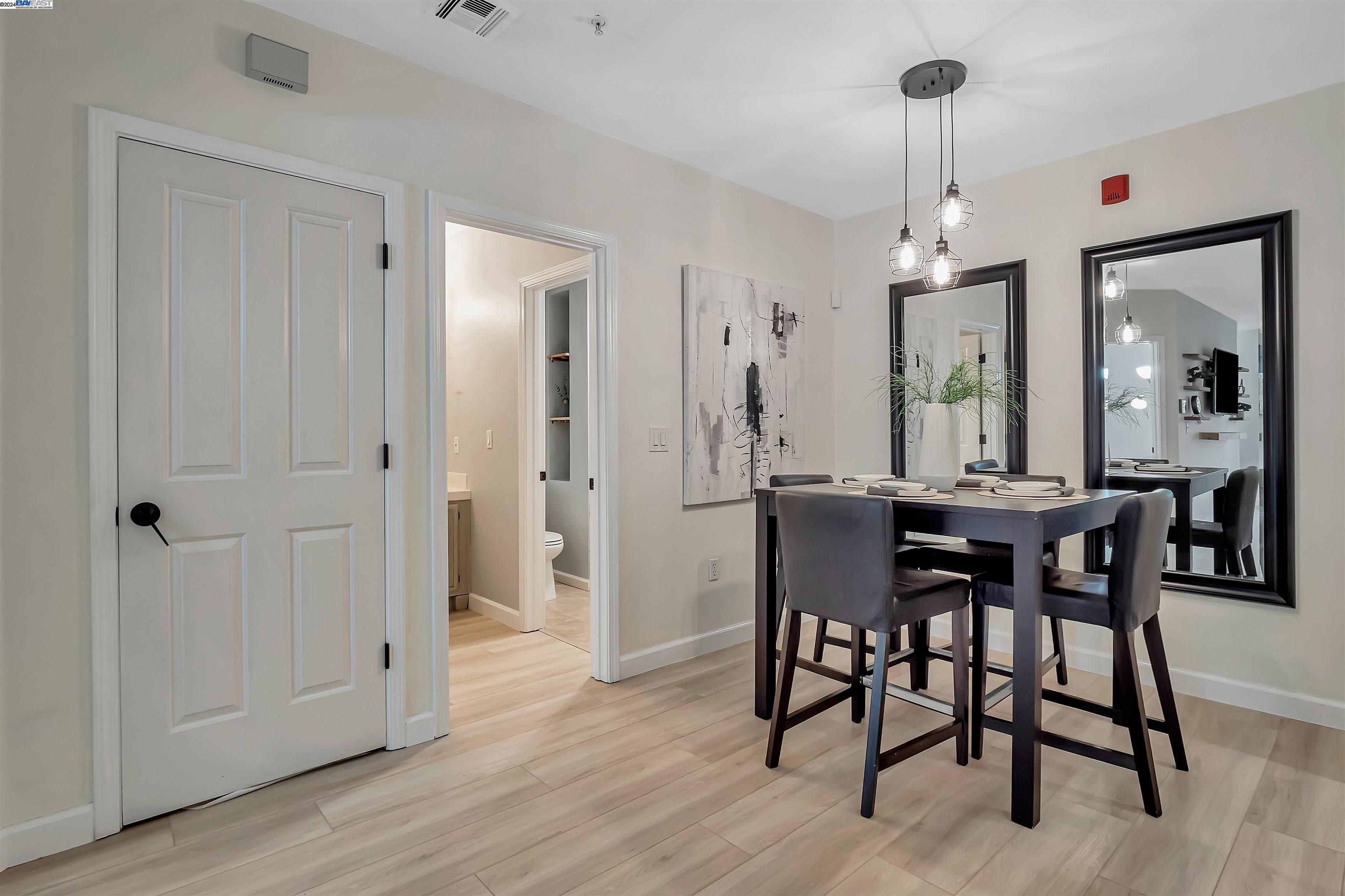 Undisclosed Address San Ramon, CA 94583 - Photo 17 of 40 a view of a dining room with furniture and wooden floor