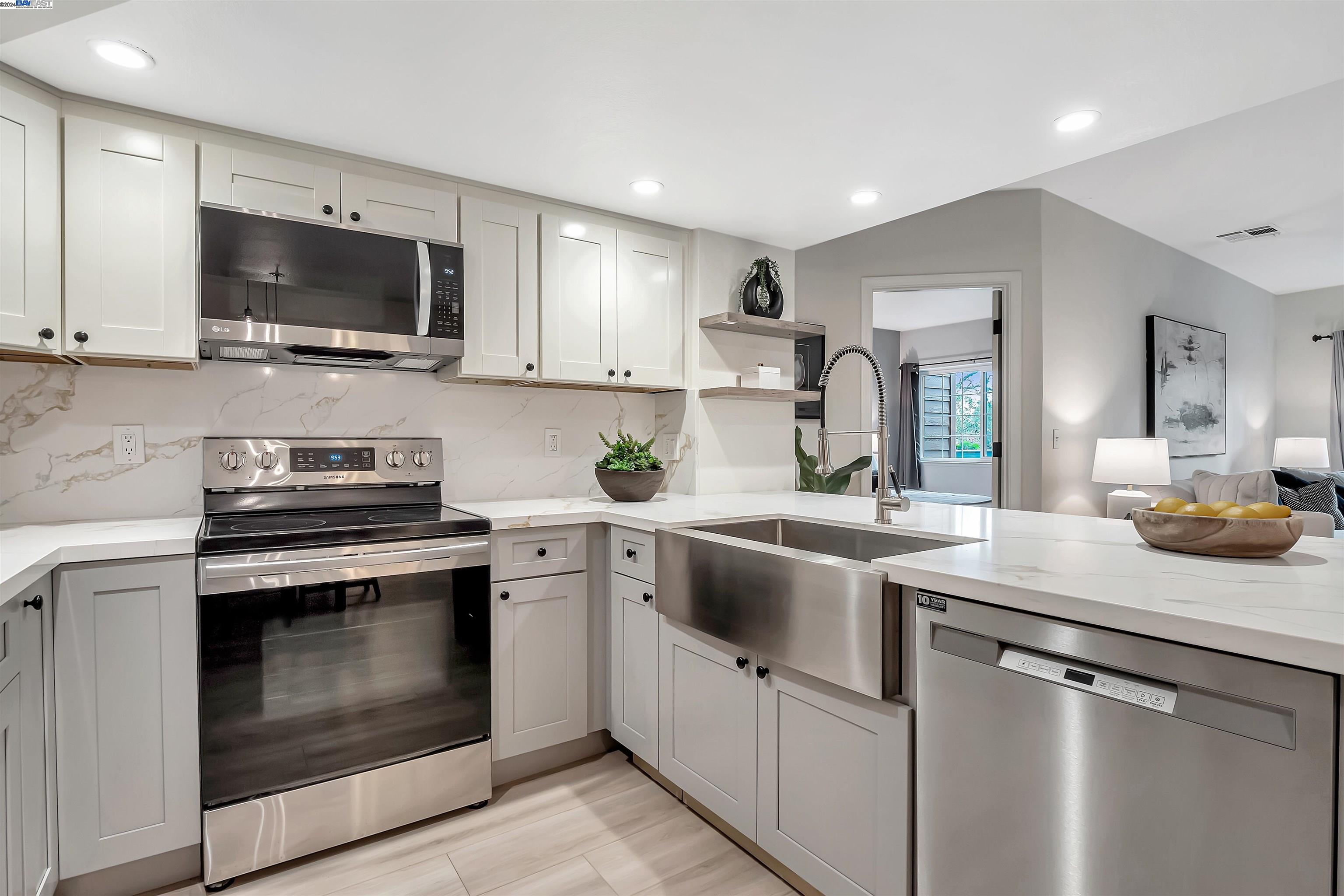 Undisclosed Address San Ramon, CA 94583 - Photo 22 of 40 a kitchen with white cabinets and stainless steel appliances