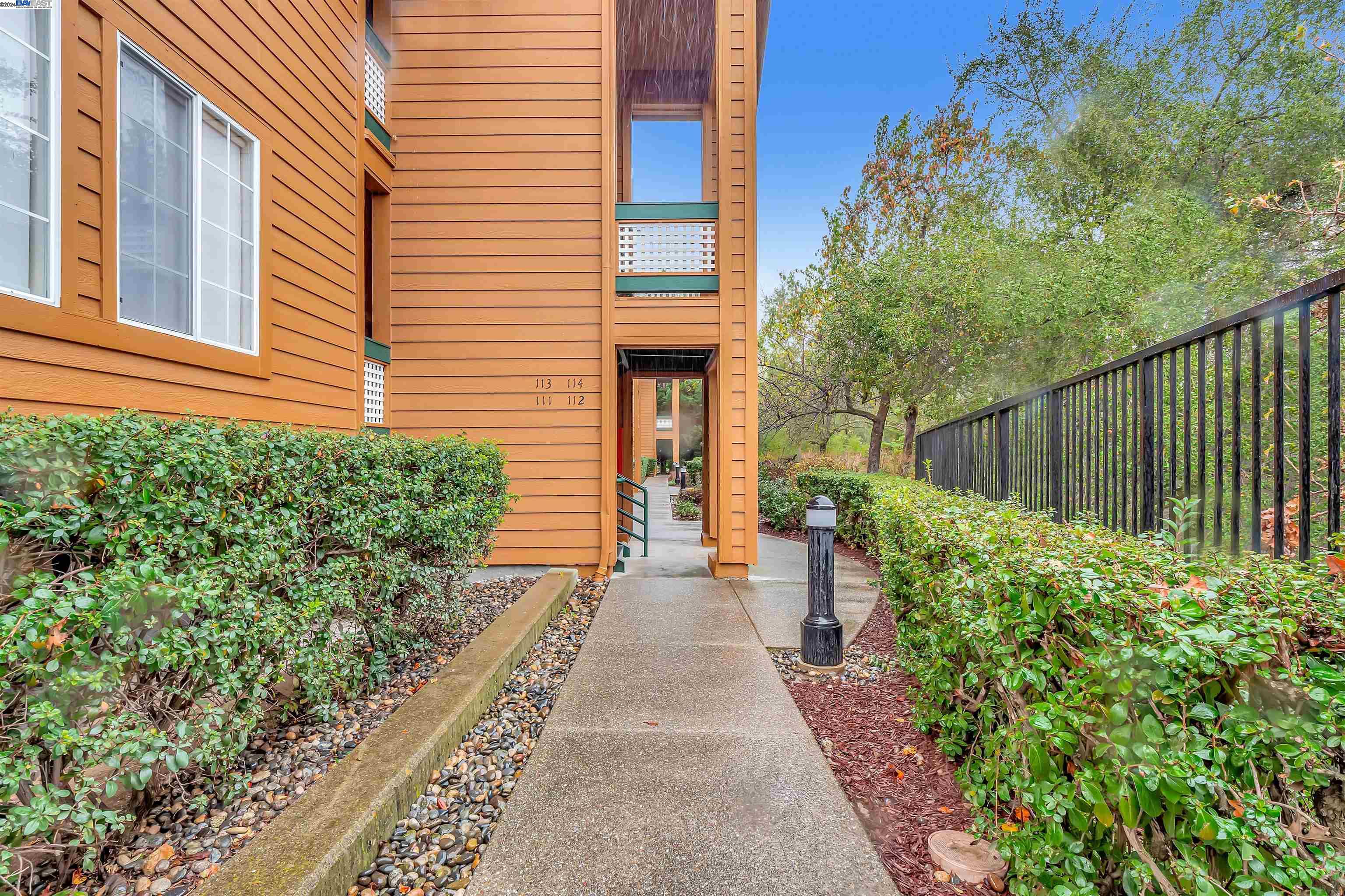 Undisclosed Address San Ramon, CA 94583 - Photo 5 of 40 a view of a pathway with flower plants