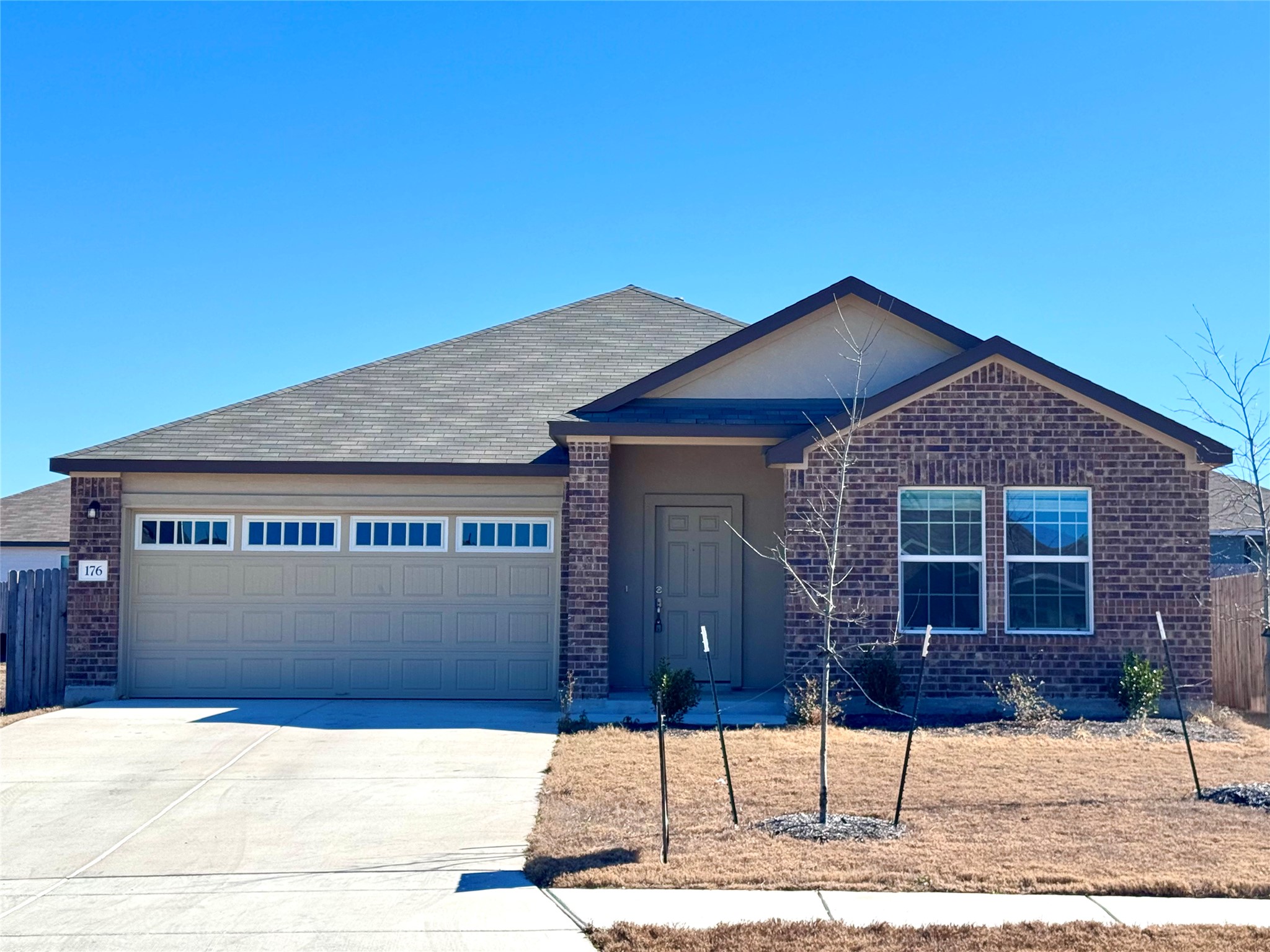 176 Mayacama Loop San Marcos, TX 78666 - Photo 2 of 21 a front view of a house with parking area