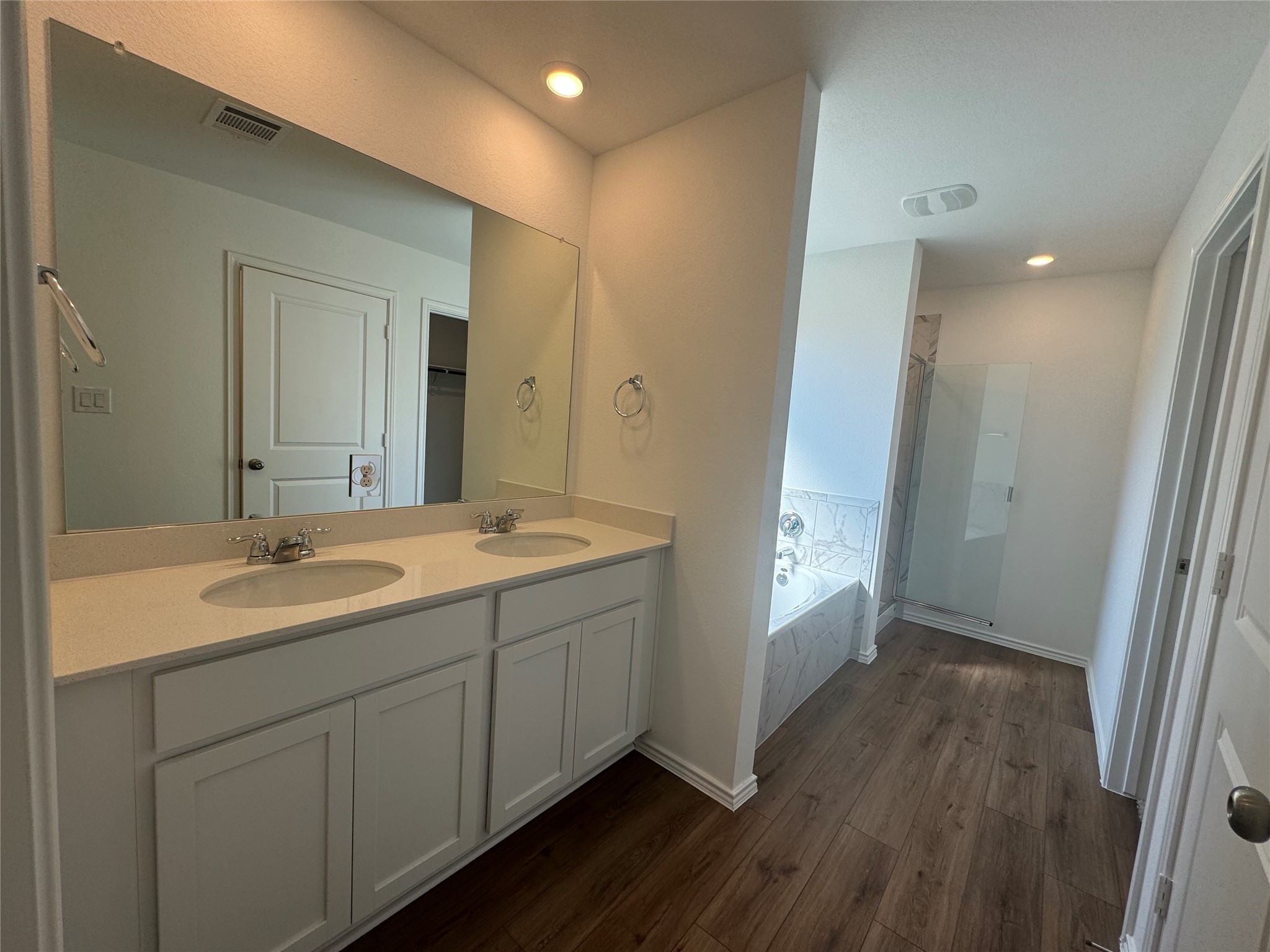 176 Mayacama Loop San Marcos, TX 78666 - Photo 9 of 21 a spacious bathroom with a double vanity sink and a mirror