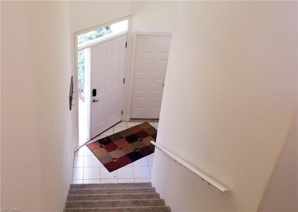 81 Silver Oaks Circle, Unit 7204 Naples, FL 34119 - Photo 5 of 33 a bathroom with a sink