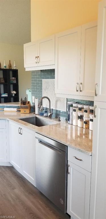 81 Silver Oaks Circle, Unit 7204 Naples, FL 34119 - Photo 9 of 33 a kitchen with stainless steel appliances granite countertop a sink stove and cabinets