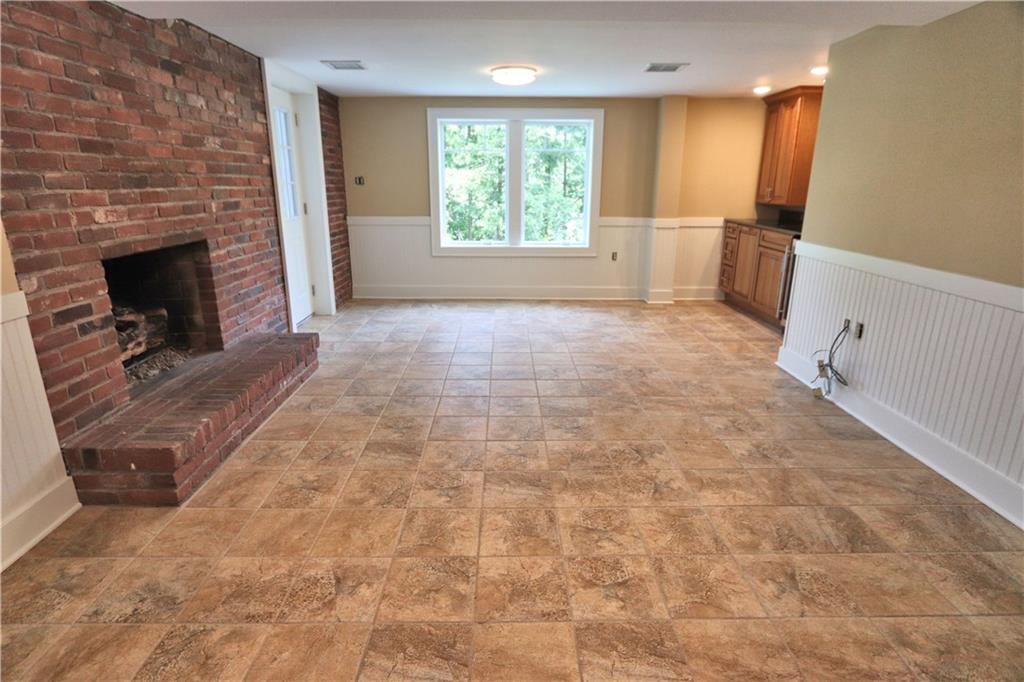 913 Old Hickory Road Pittsburgh, PA 15243 - Photo 20 of 25 Bright and airy Lower level game room with gas FP, beverage station, and access to patio and back yard.