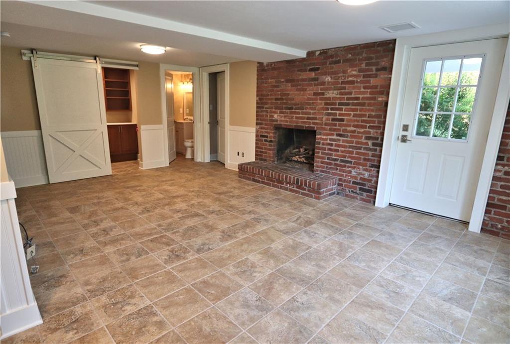 913 Old Hickory Road Pittsburgh, PA 15243 - Photo 21 of 25 Game room has a craft room/wrapping station behind the barn door, a half bath, a mudroom off patio, and access to oversized 2 car garage.